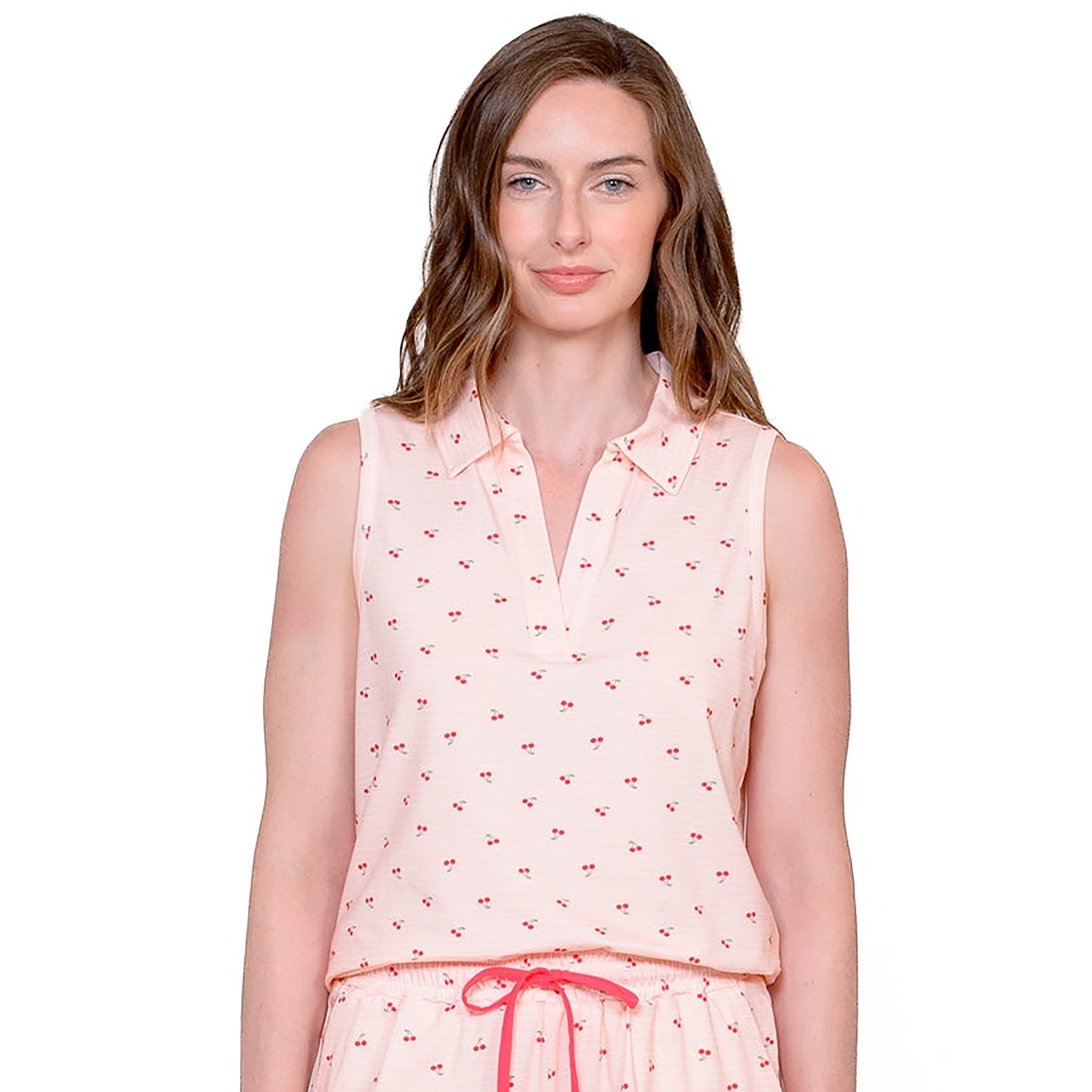 Close-up of soft pink PJ top with tiny red cherries and notch collar.