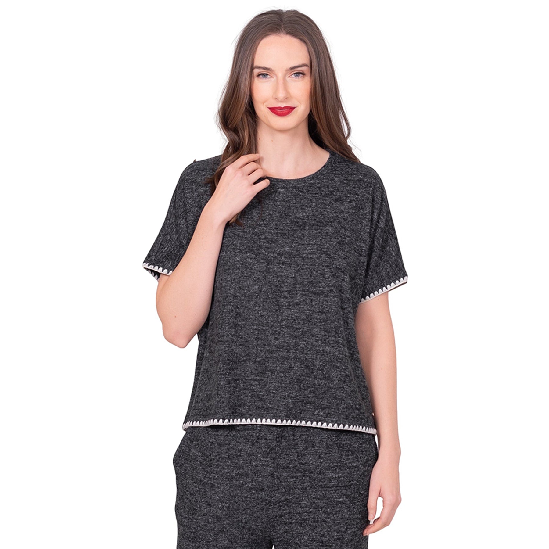 Close-up of LatteLove lounge top in black mélange fabric with decorative stitching on sleeves and hem.