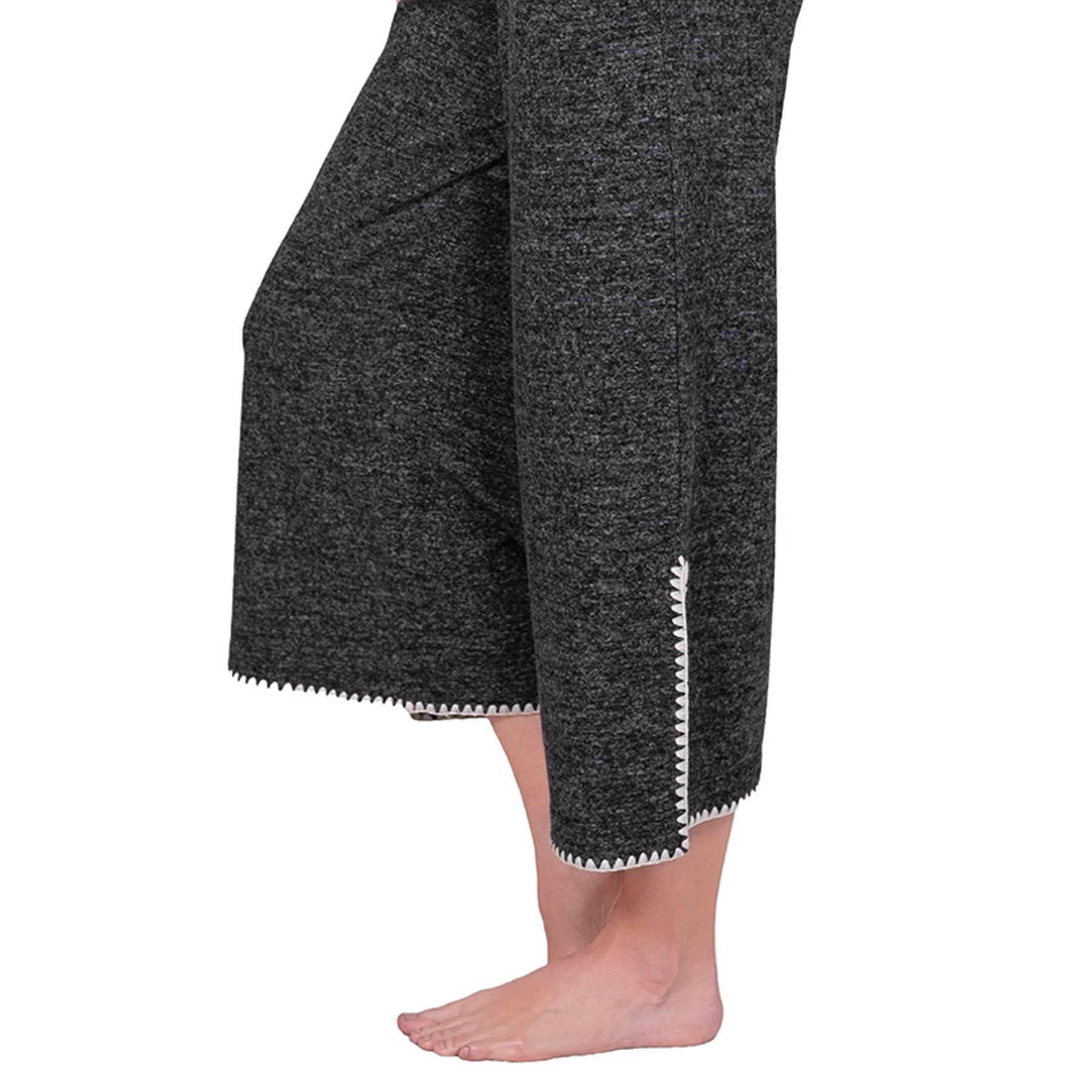 Side view close up of LatteLove Black Mix lounge set showing short sleeves and wide-leg pants with contrast trim.