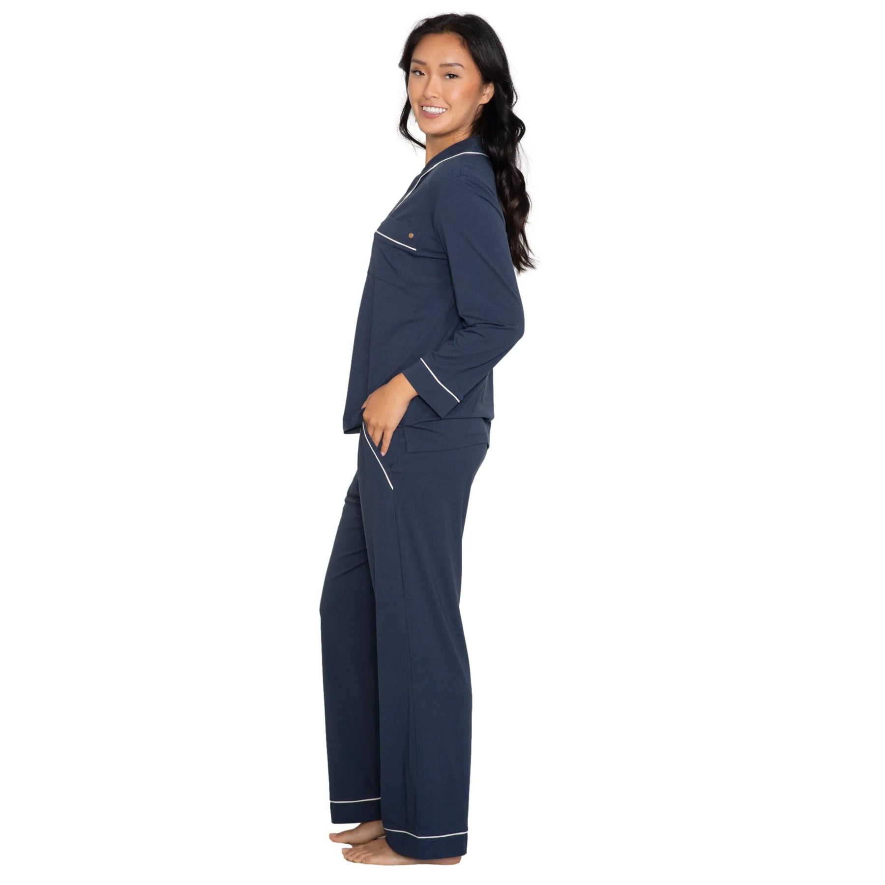Classic navy pyjama set with soft drape, contrast trim details, and wide-leg pants, side view on model
