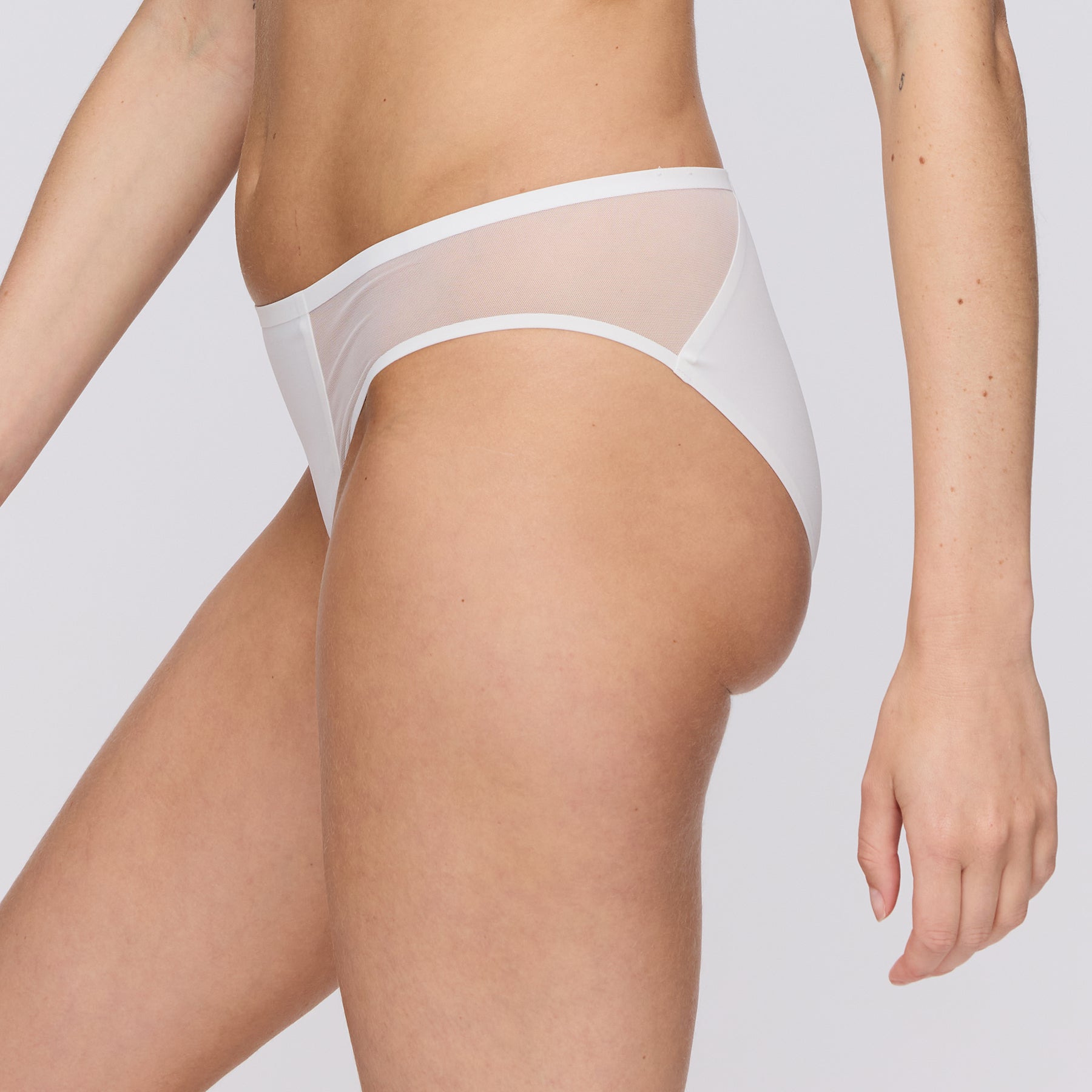 Side view of Marie Jo Louie Rio Panty in Natural, highlighting sheer mesh side panels and soft waistband.