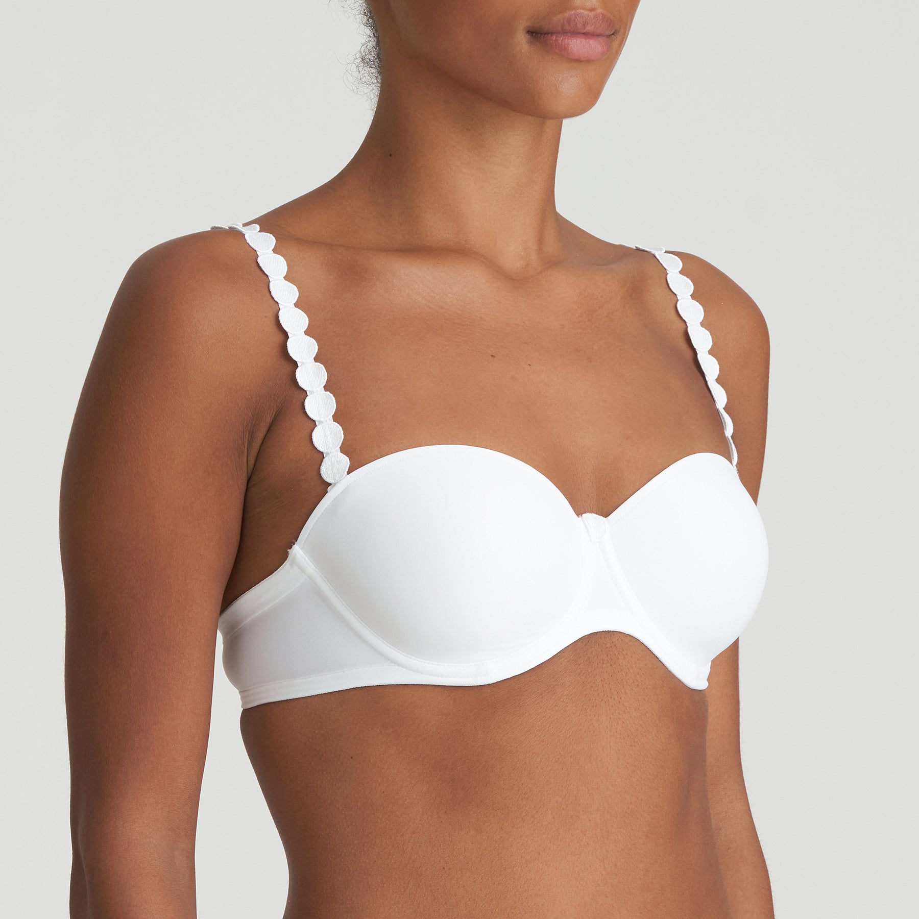 Side view of Marie Jo Tom Strapless Bra in White – smooth moulded cups with underwire support and minimalist feminine design.
