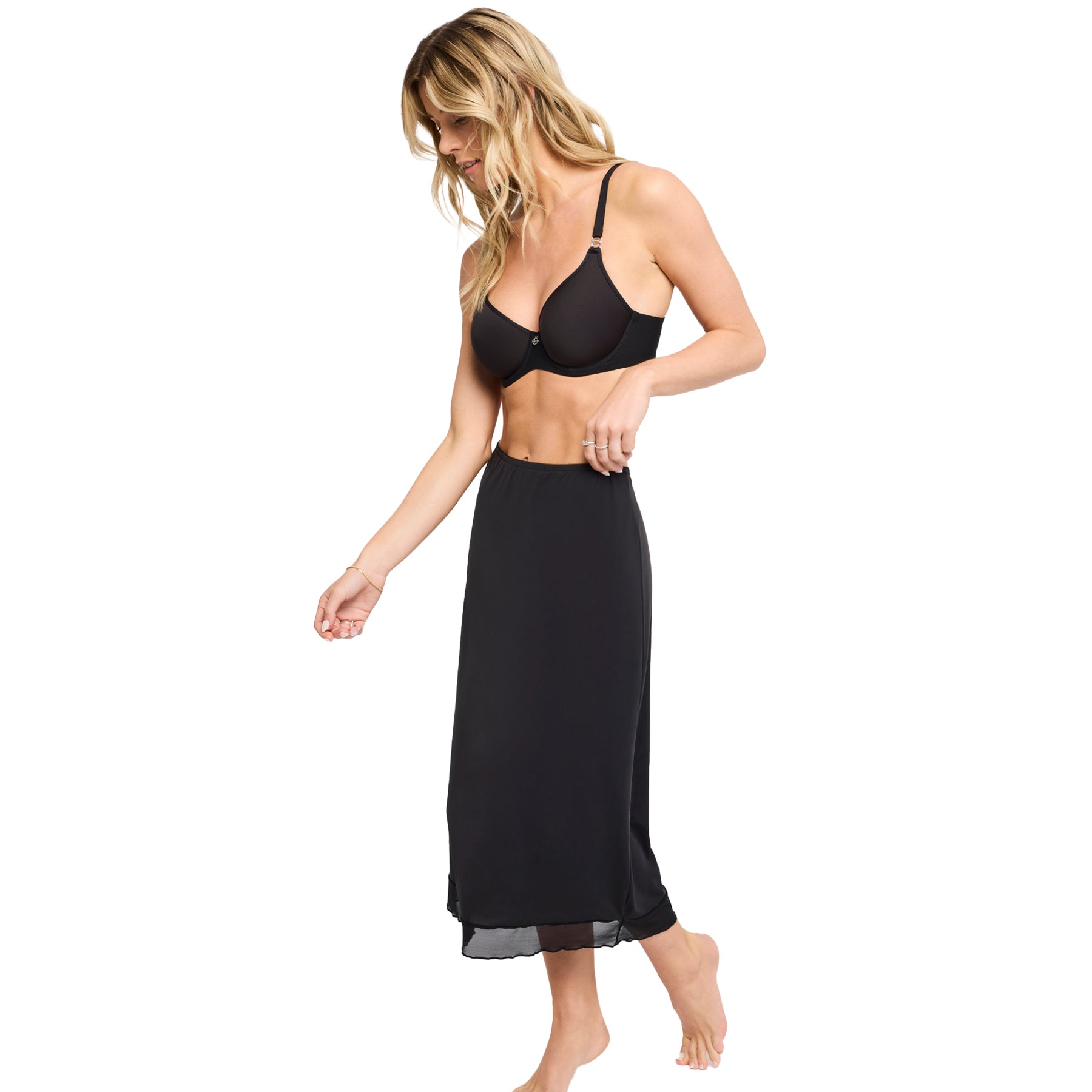 Side walking view of Montelle black maxi half slip - flowy and lightweight fit.