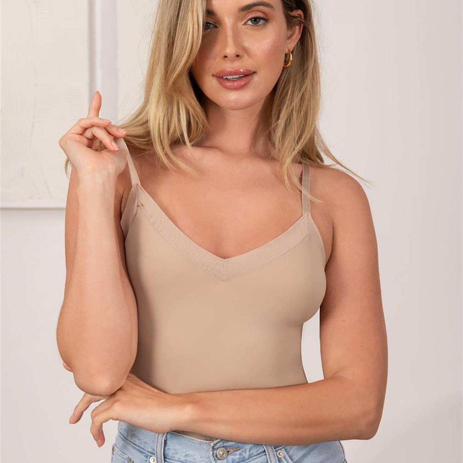 Sand camisole slip shown as layering piece with denim