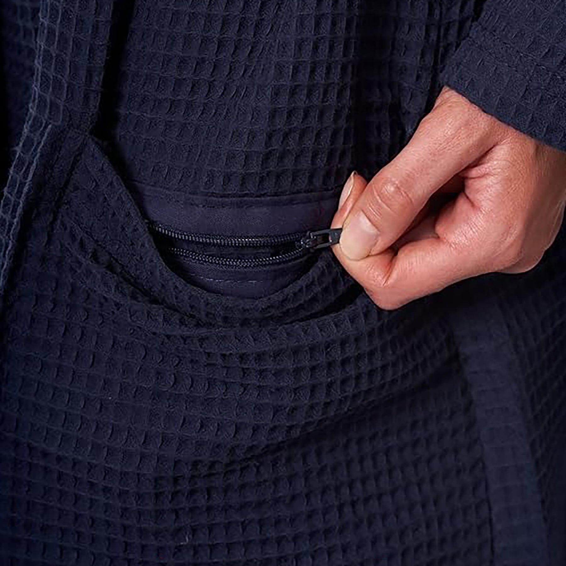 Hidden zipper pocket detail on navy waffle robe – secure and discreet storage for essentials.