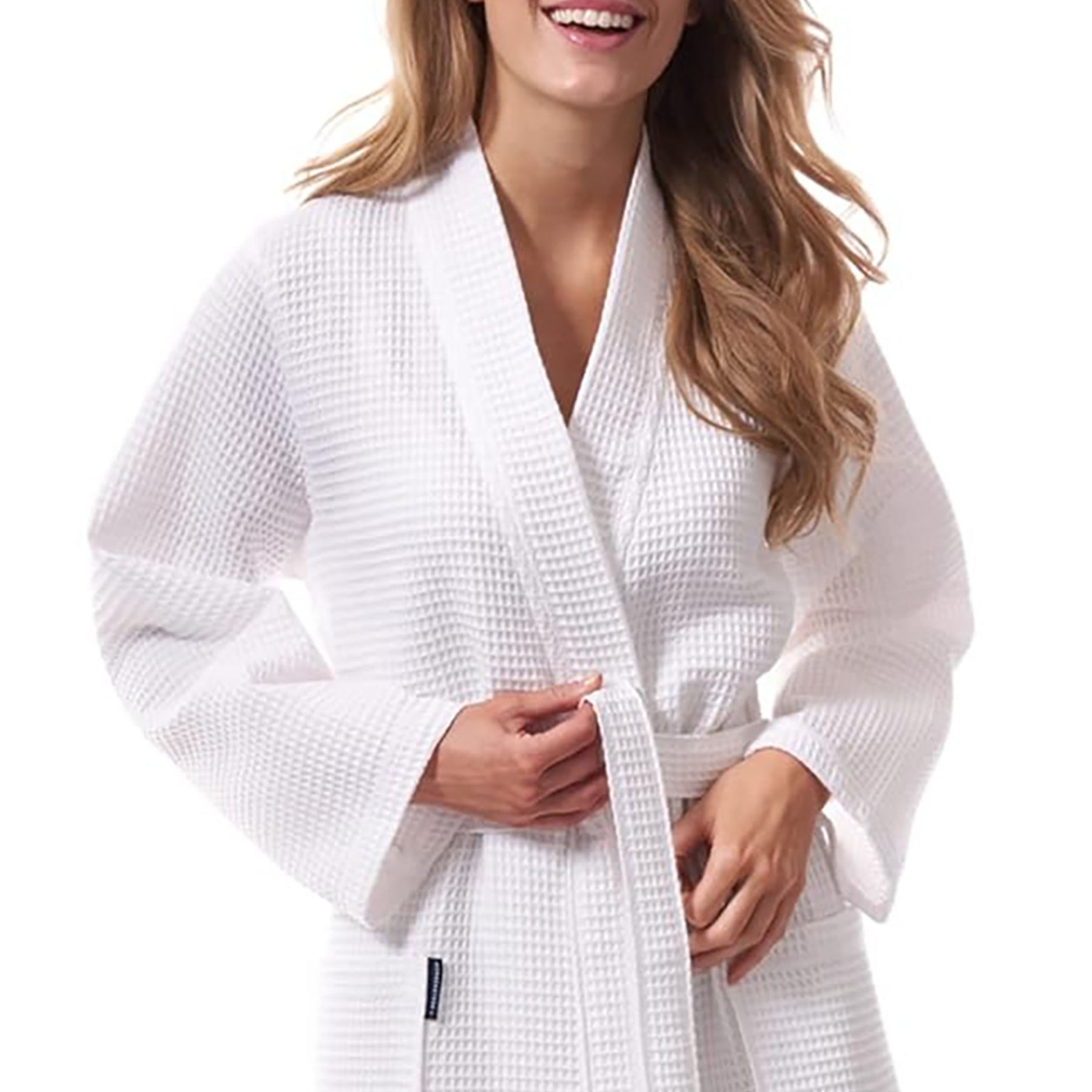Morgenstern unisex short waffle robe in white – 100% cotton wrap robe with belt and front pockets. Close up on model.