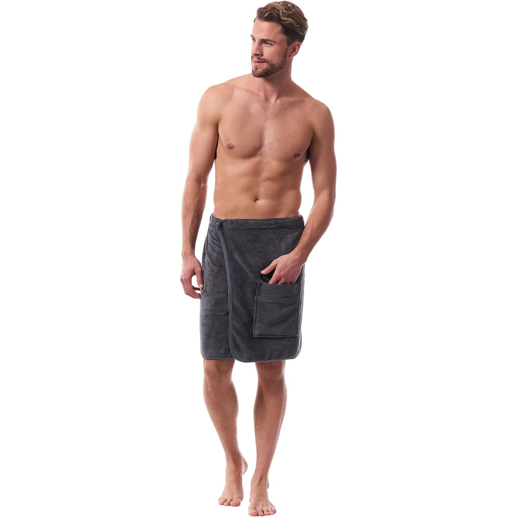 Angled view of man wearing graphite spa towel wrap – plush fleece exterior and practical pocket design.
