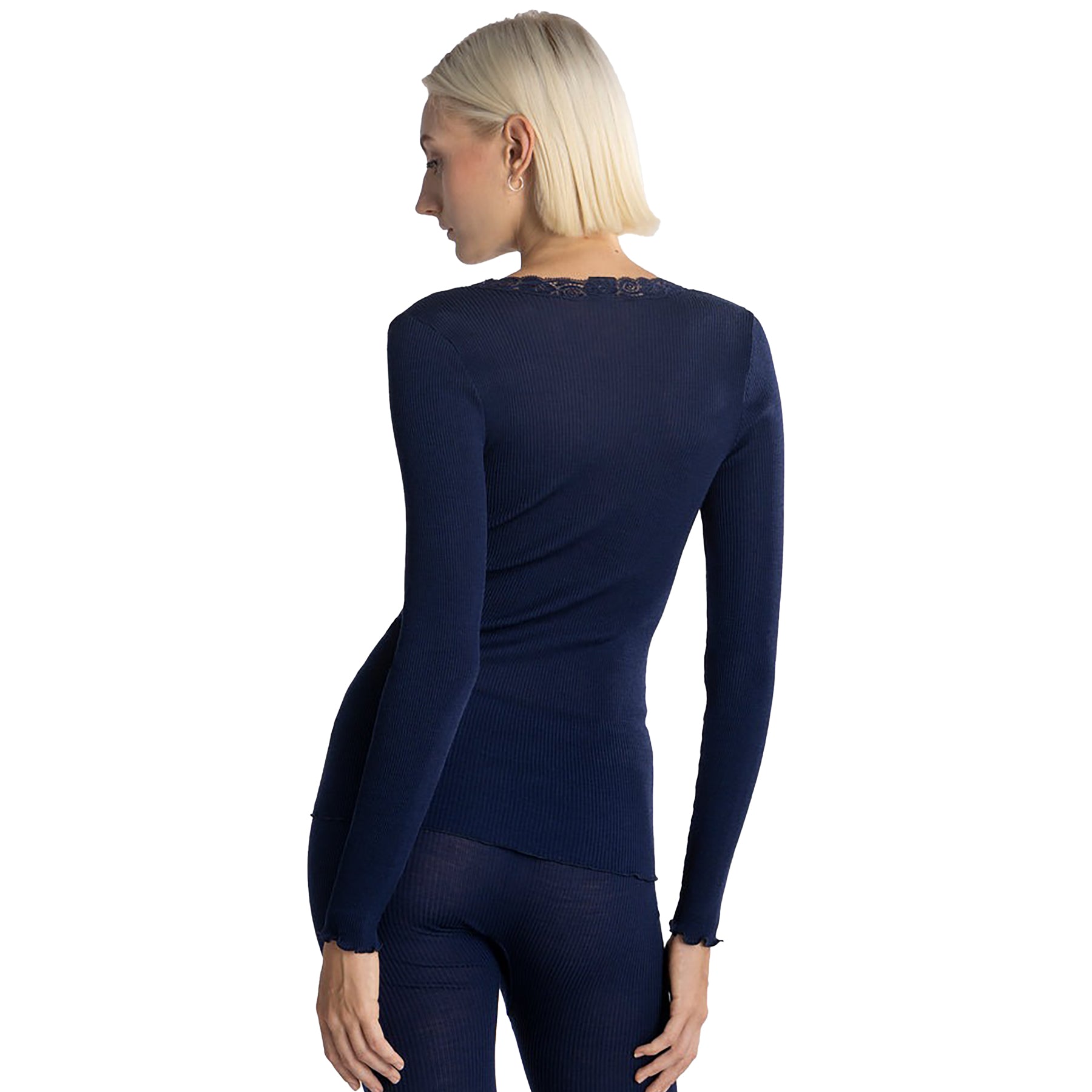 Long sleeve ribbed wool and silk knit top with lace trim neck in bleu navy on model, rear view.
