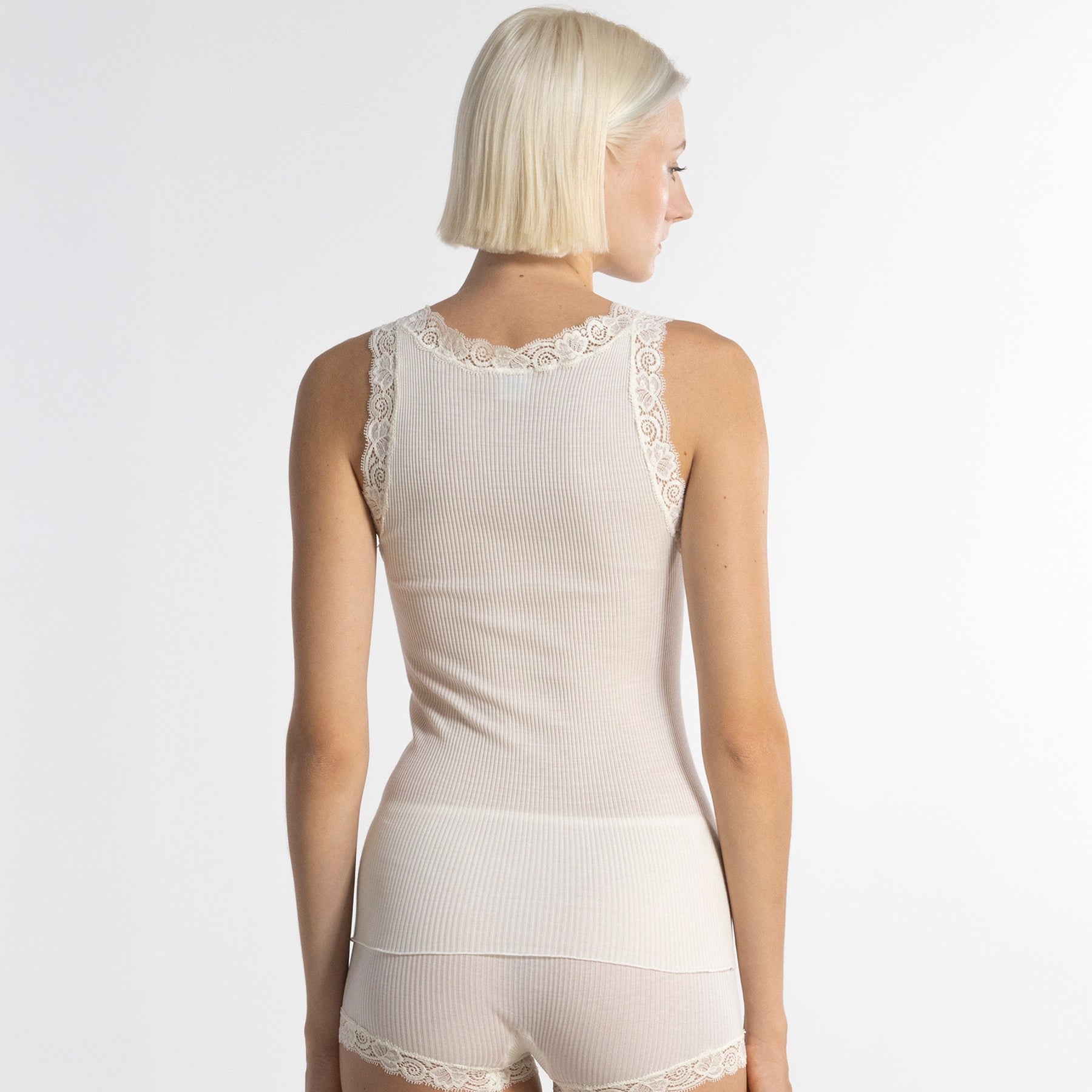 Back view of Oscalito 3410 Lace Trim Ribbed Tank in Champagne – elegant Italian-made tank with lace shoulder accents and smooth ribbed texture.