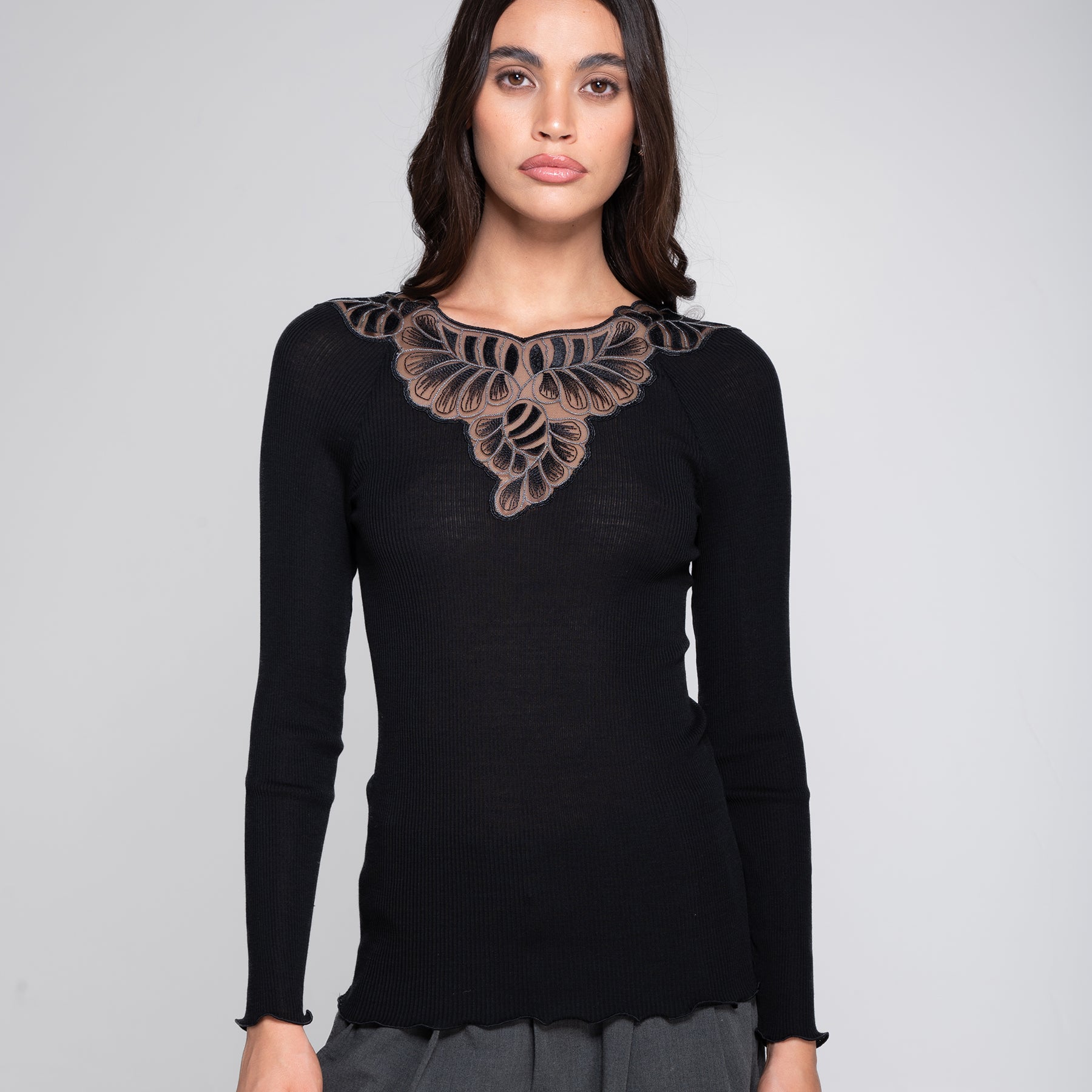 Oscalito 7618 long sleeve ribbed wool silk top in black (nero 020) with sheer embroidered neckline – on model front view