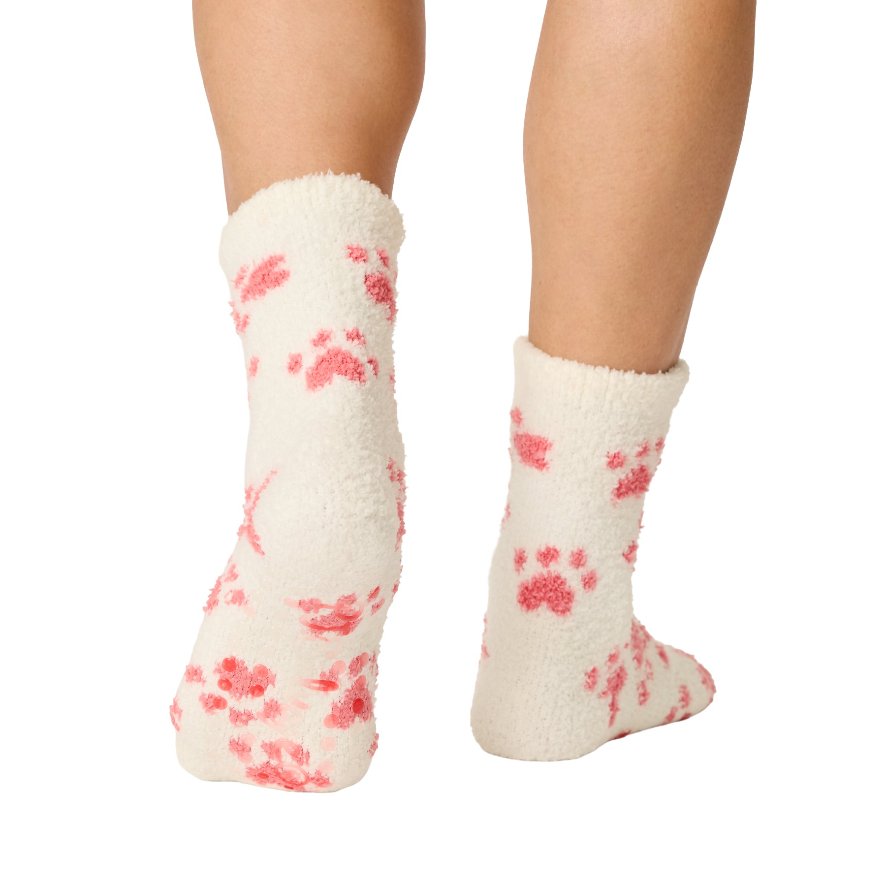 Back and sole view of ivory paw print socks featuring non-slip grips for added traction.