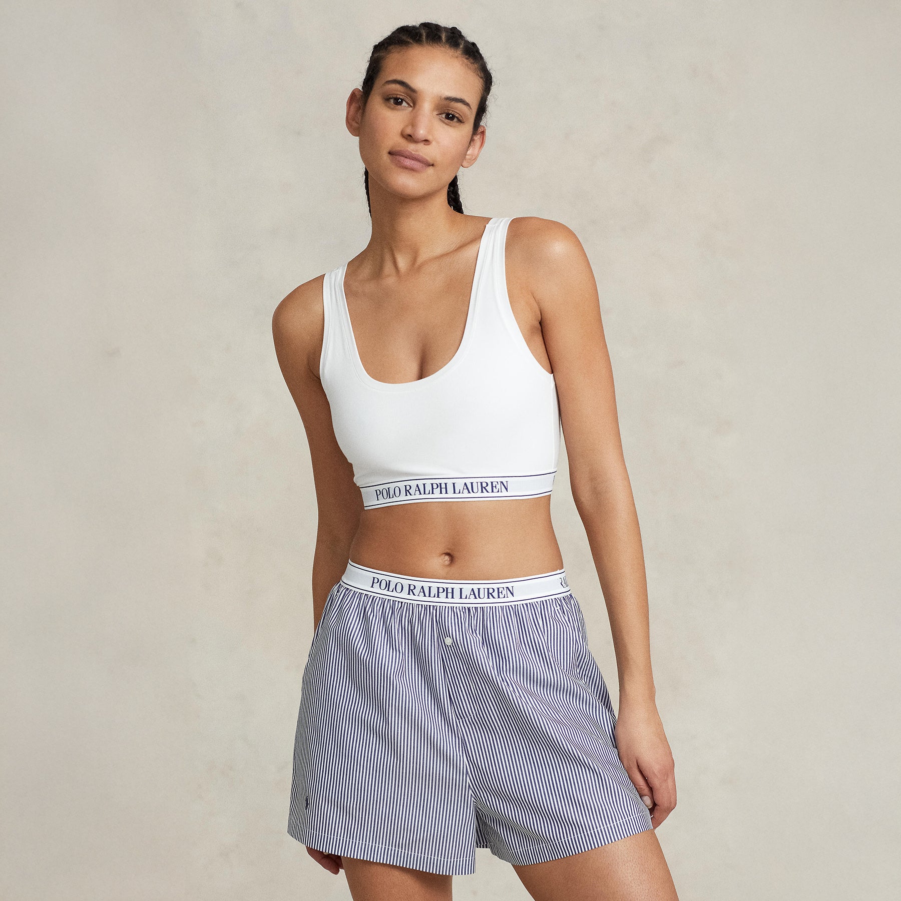 Model wearing Polo Ralph Lauren White Cropped Bralette and striped boxer shorts front view