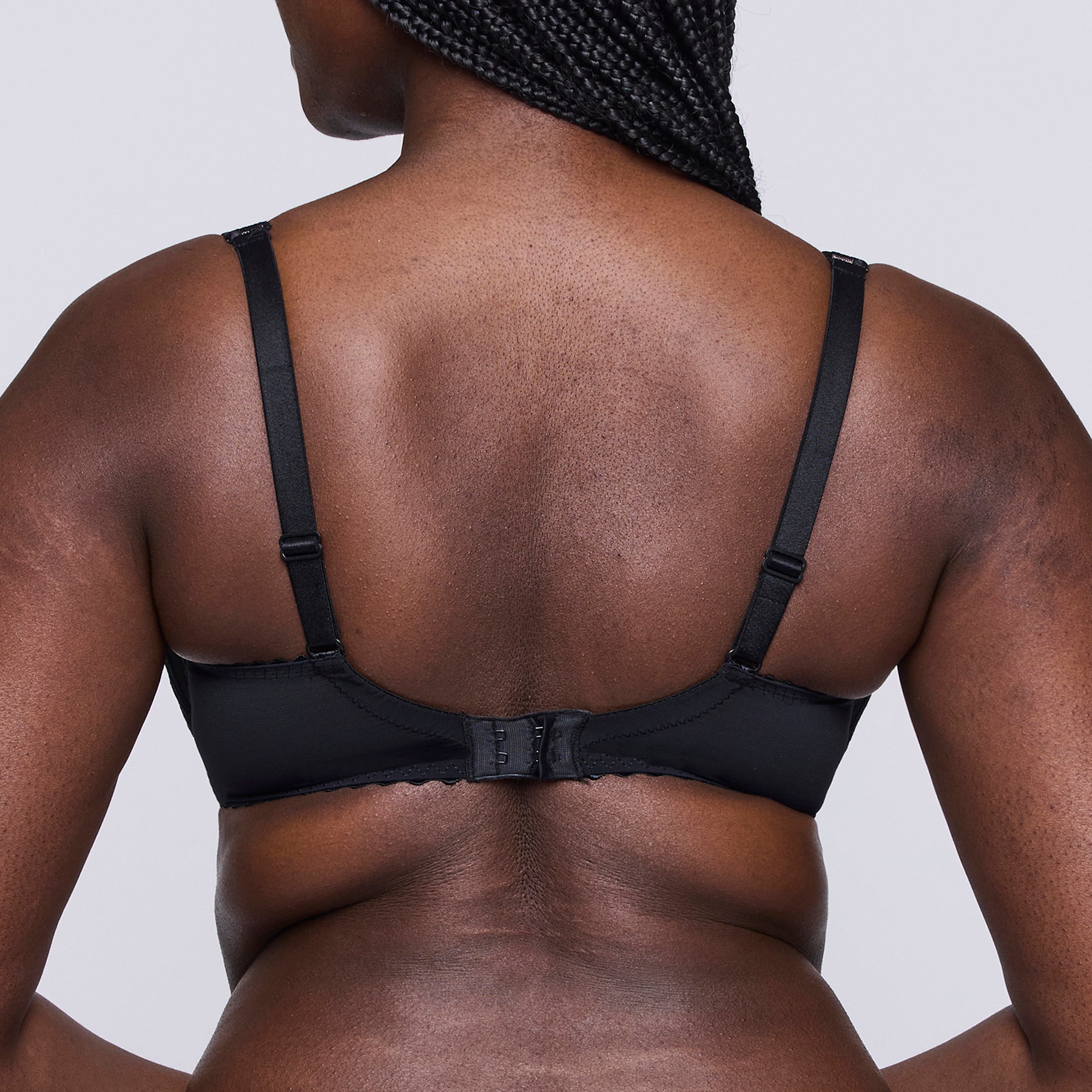 Back view of PrimaDonna Gallipoli black balcony bra with smooth band, adjustable straps, and hook-and-eye closure.