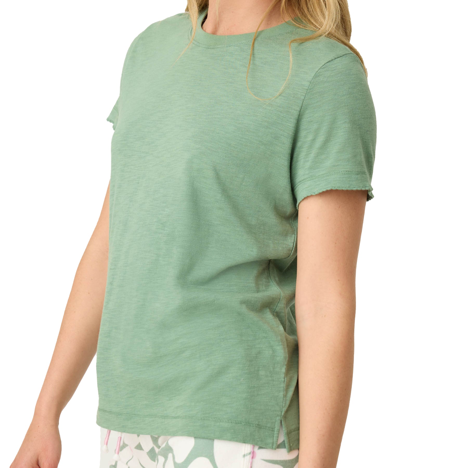 Side detail of light green short-sleeve T-shirt with casual rolled hem.