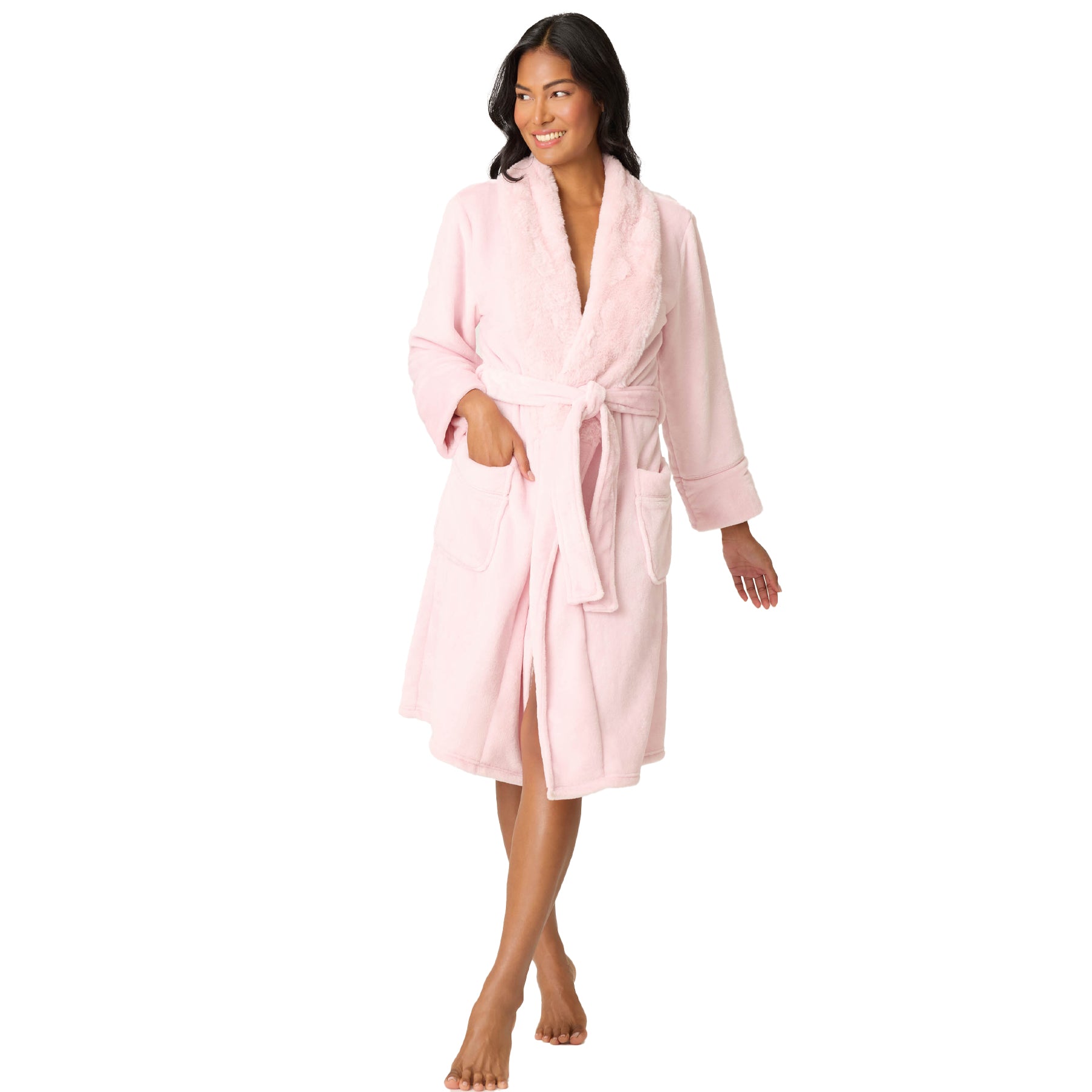 Woman wearing a pink robe on a white background