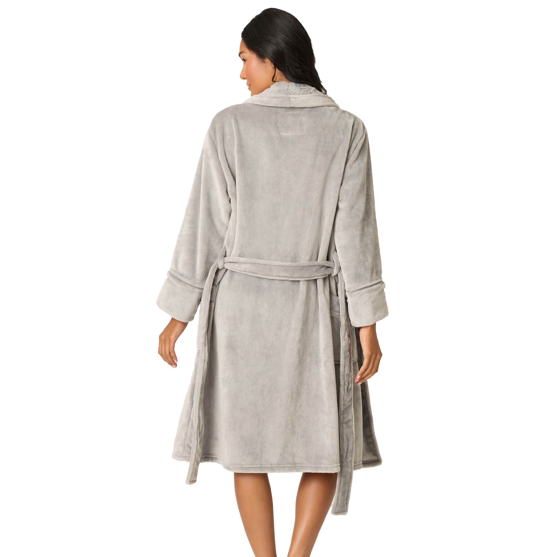 Woman wearing a gray robe on a white background