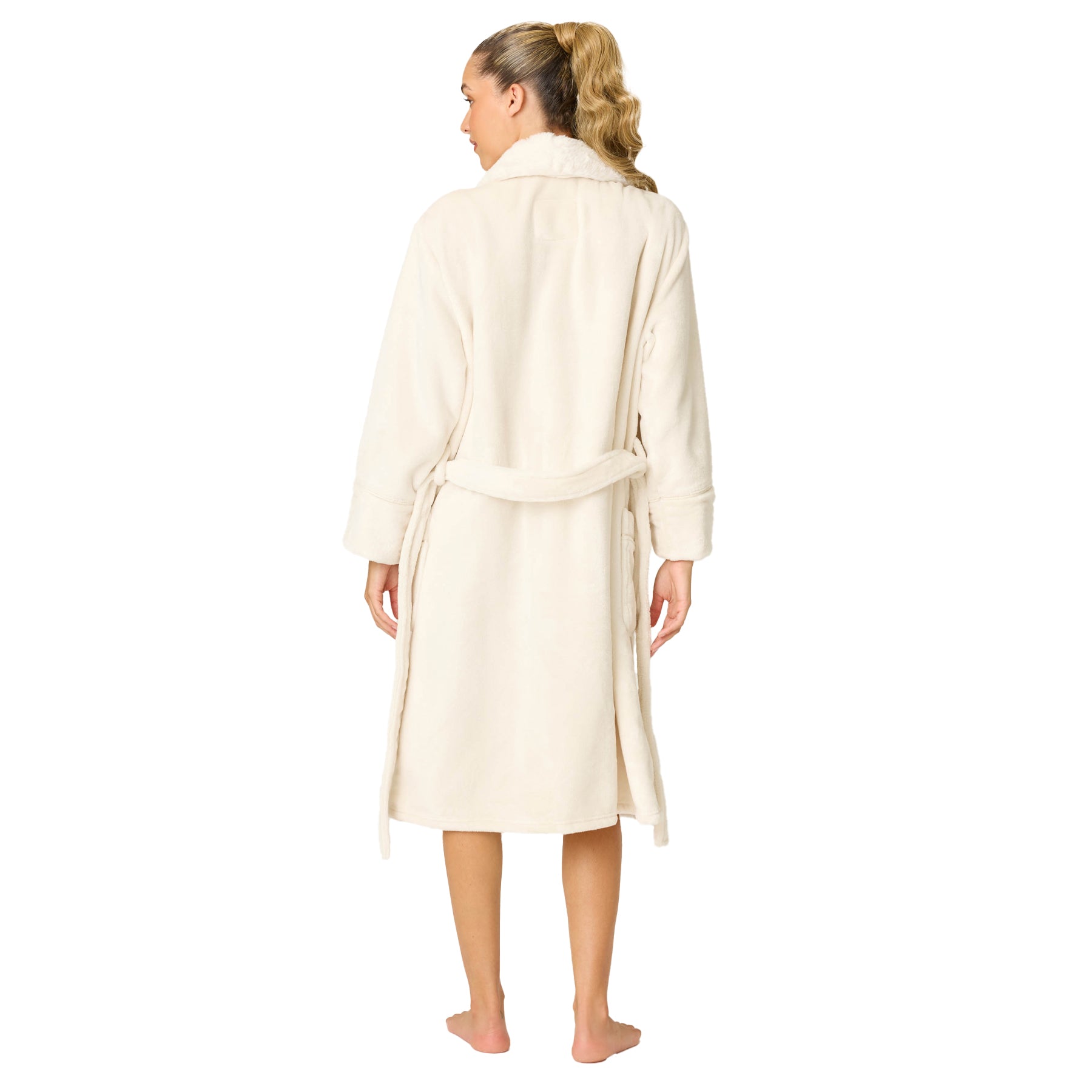 Woman wearing a cream-colored robe on a white background