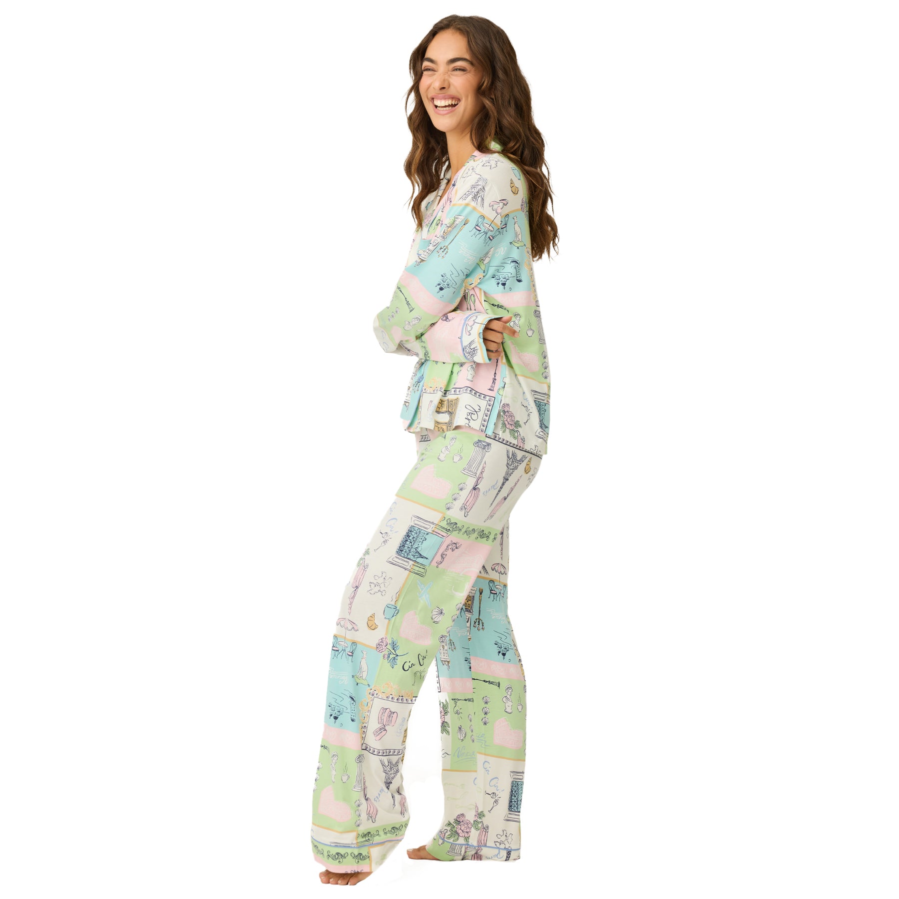 Side view of the pastel printed pyjama set with relaxed fit long sleeve top and straight-leg pants, worn by a model on a white background.