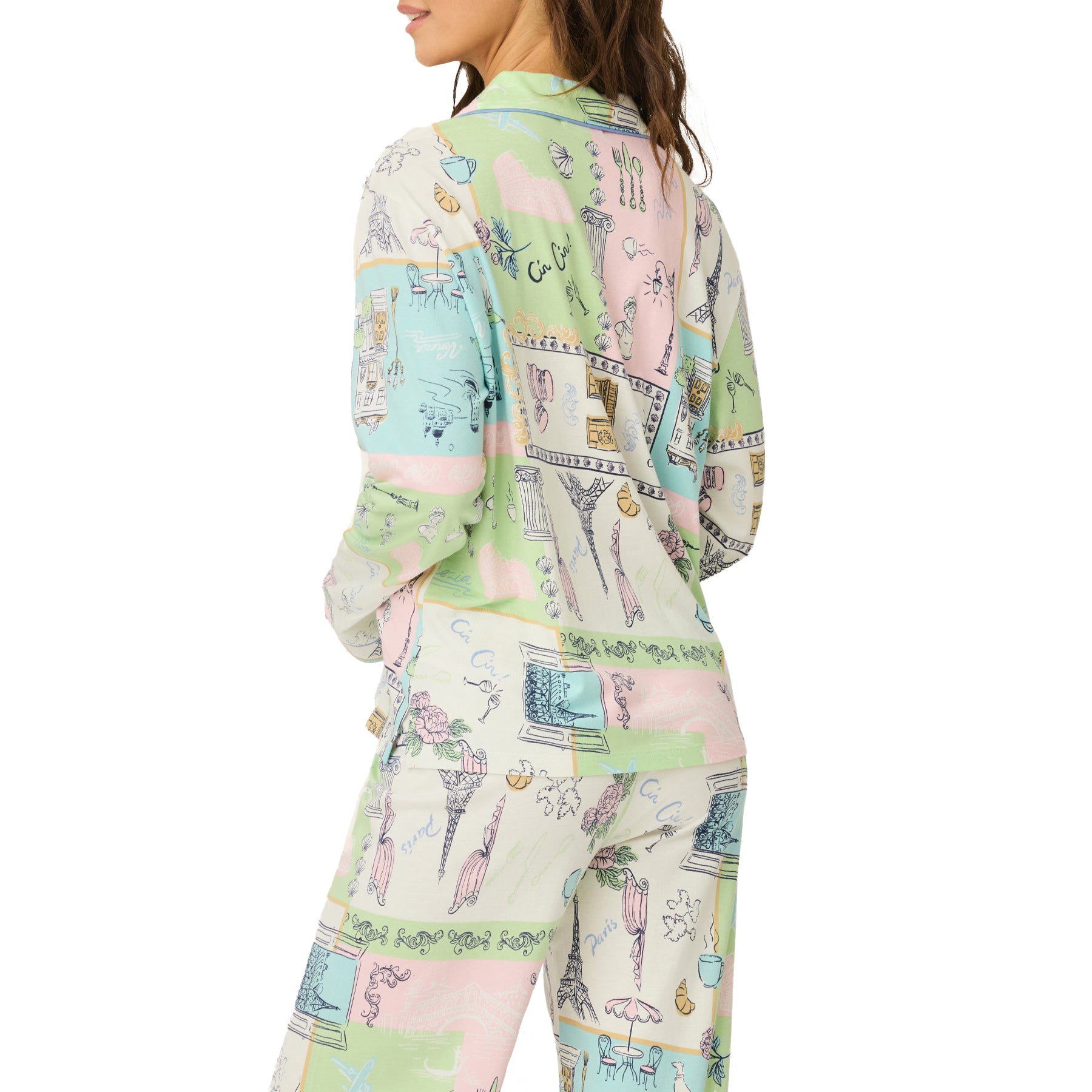 Back view of the long sleeve pyjama top and matching pants highlighting the all-over pastel travel-themed print.