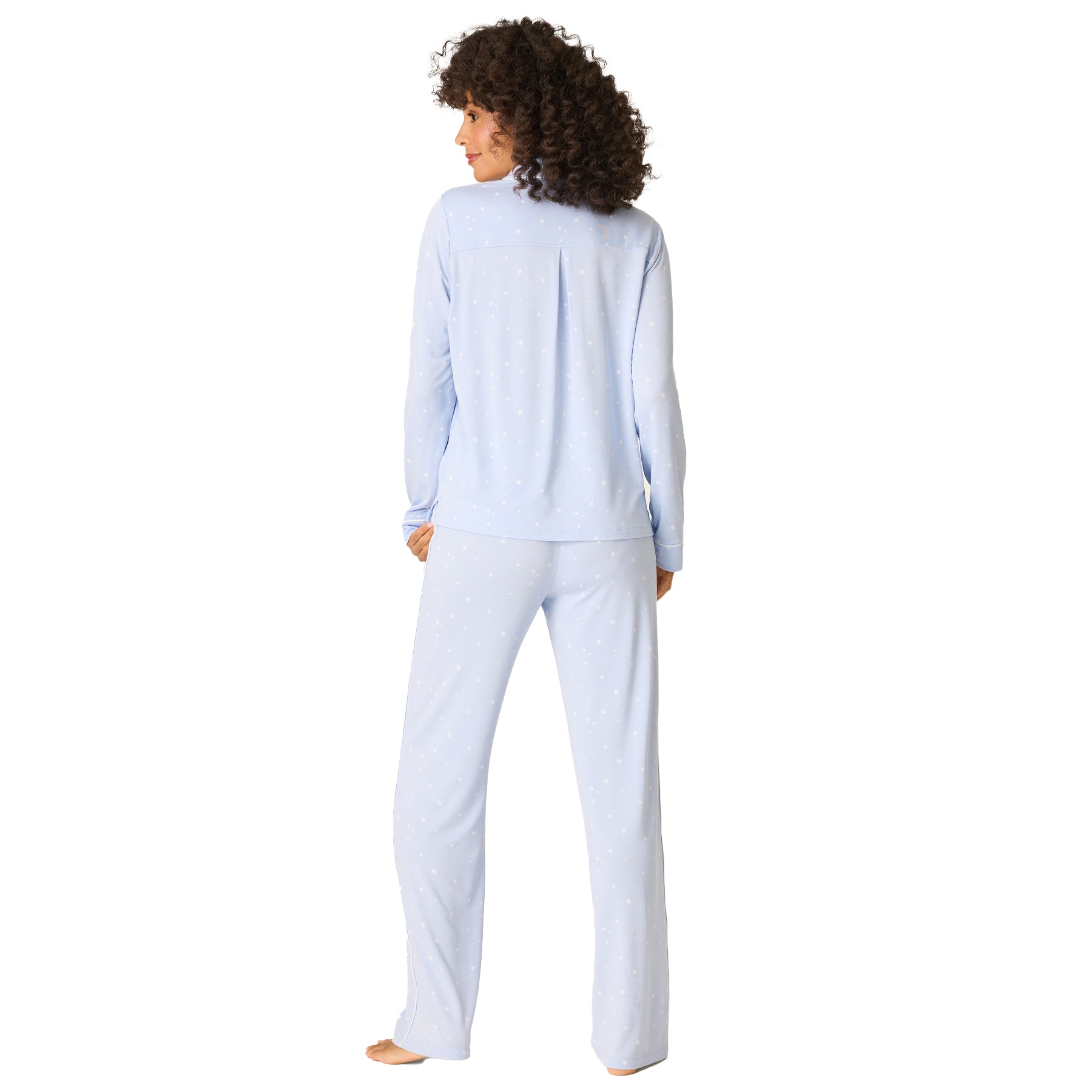 Back view of women’s baby blue pyjama set with long sleeves and matching pants, white star pattern