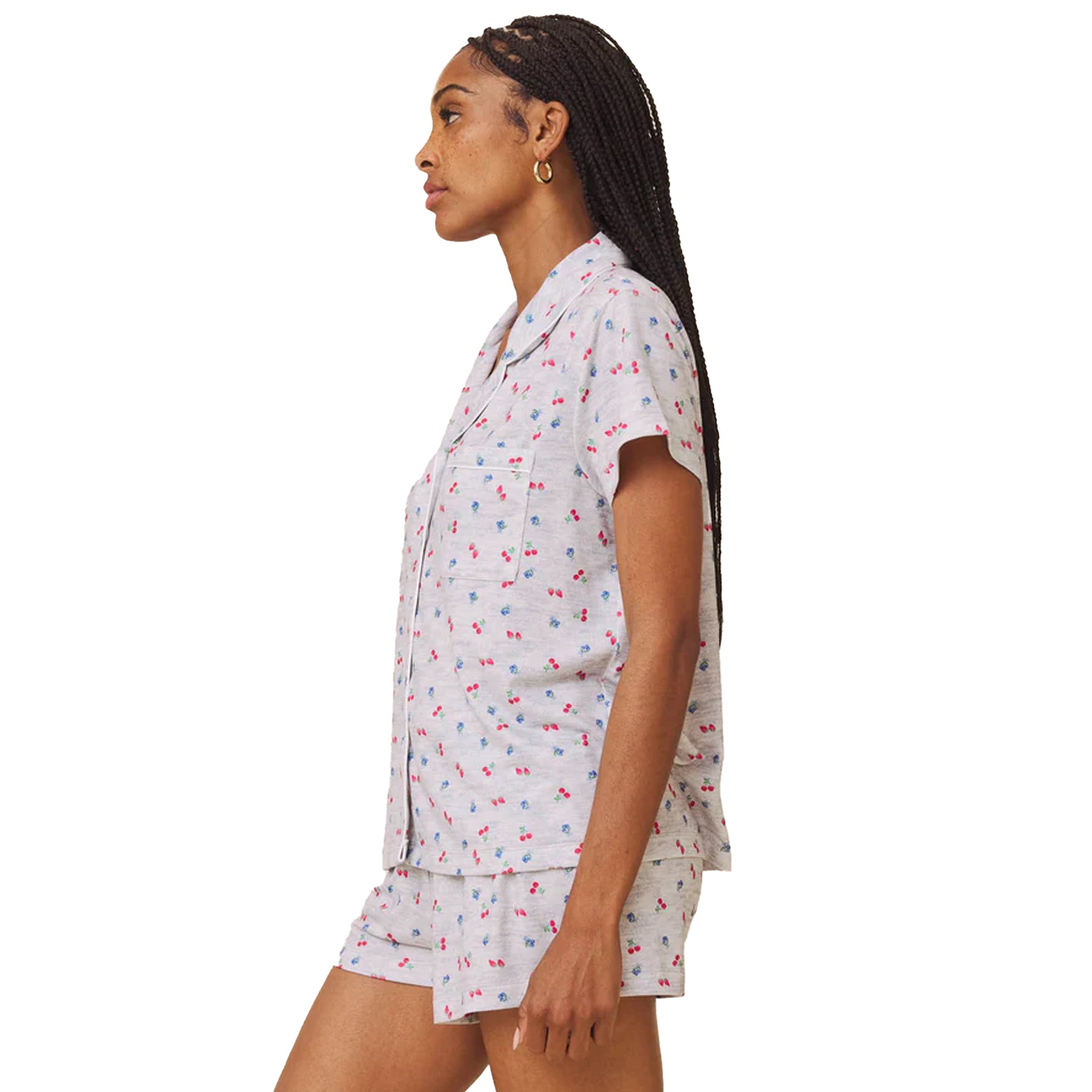 Side profile of grey printed short sleeve pyjama set with button-up top and shorts