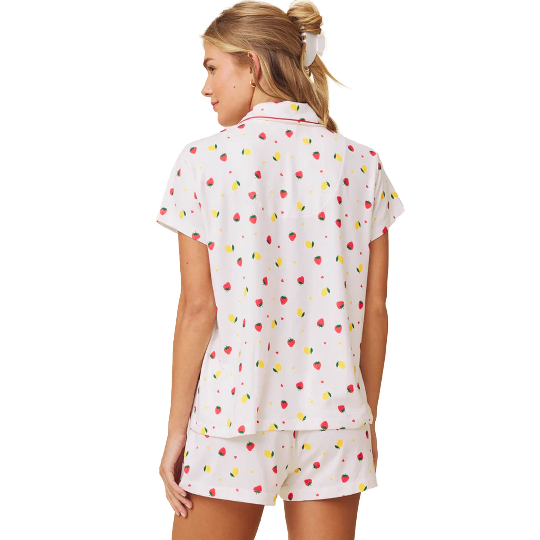 Back view of white short sleeve pyjama set with fruit print and relaxed fit shorts