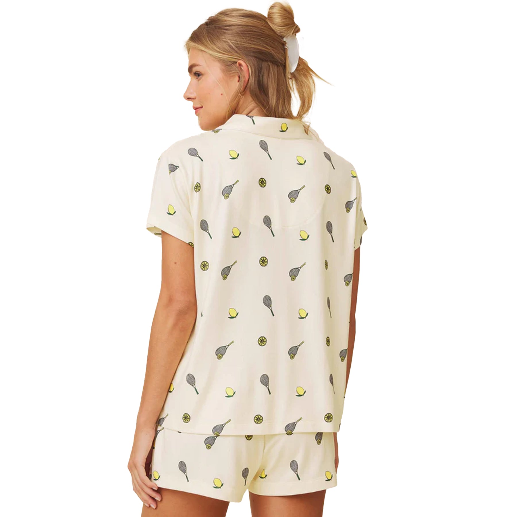 Back view of pale yellow short sleeve pyjama set with playful lemon and tennis motif