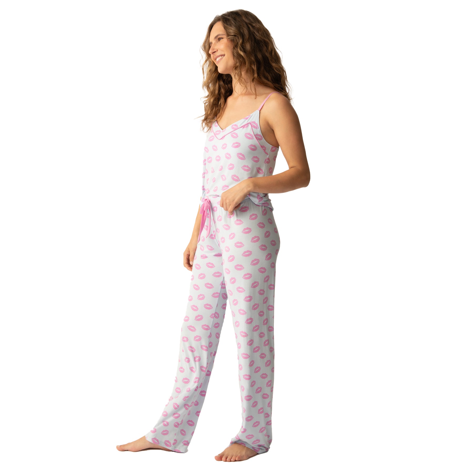 Playful pink lip-print pajama set with a camisole top and relaxed-fit pants, featuring a pink drawstring tie for a cozy and feminine look.