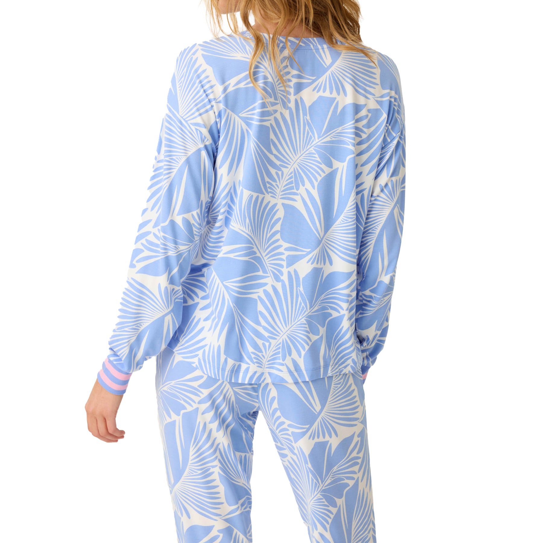 Back view of blue and white tropical print lounge set showing relaxed fit.