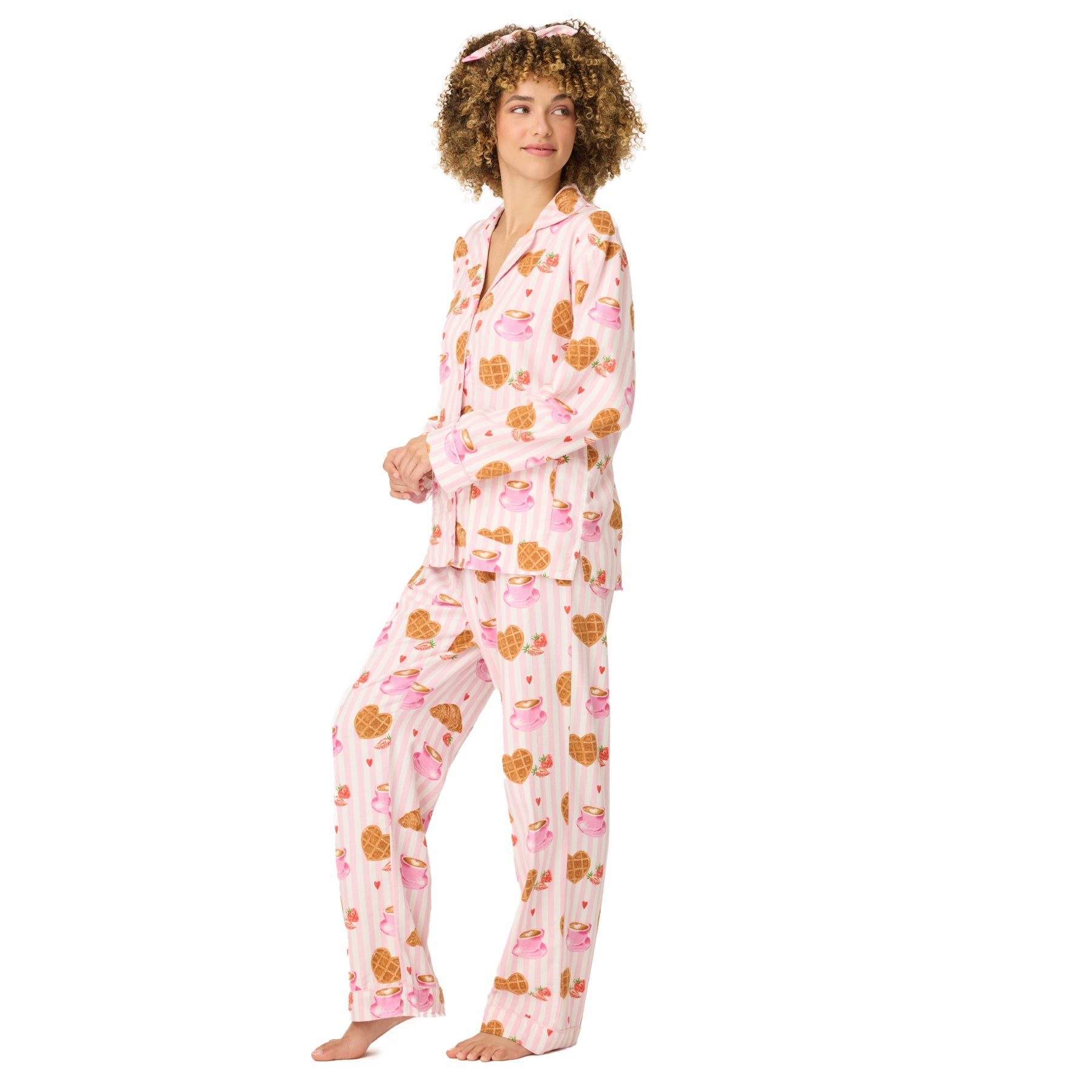 Full view of women’s striped pajama set with croissants, waffles, and coffee cup design.
