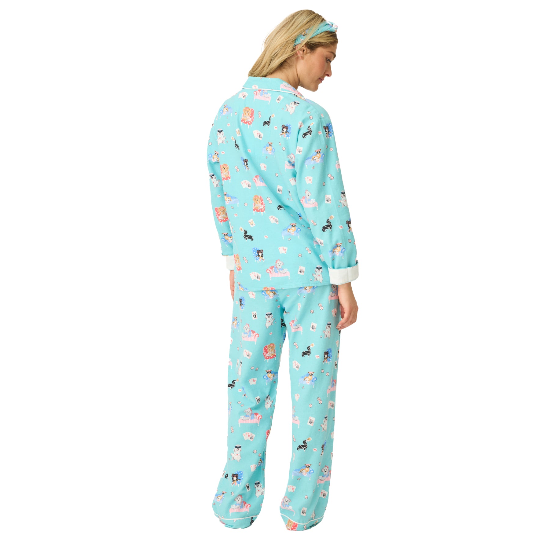 Back view of women’s turquoise pajama set with playful dog print.