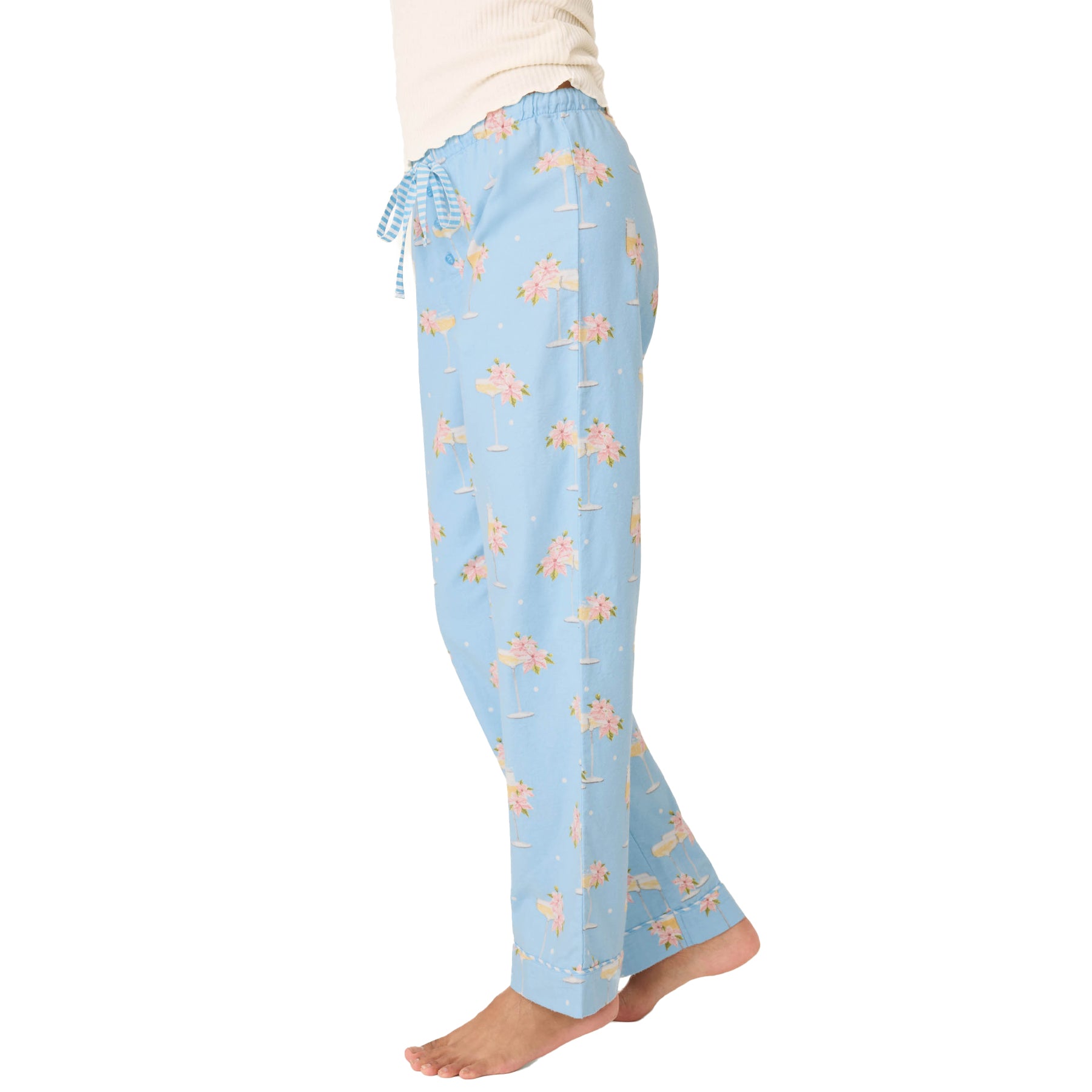 Light blue pajama pants with a pattern on a white background