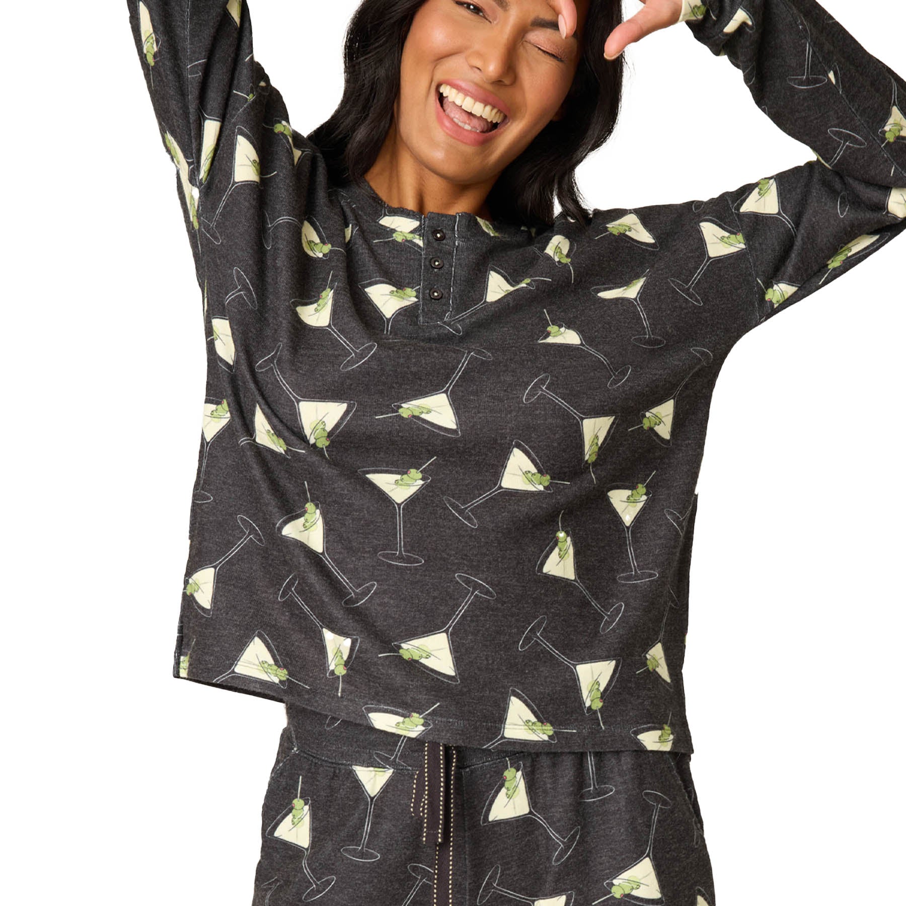 Person wearing a dark gray hoodie with martini glass pattern on a white background