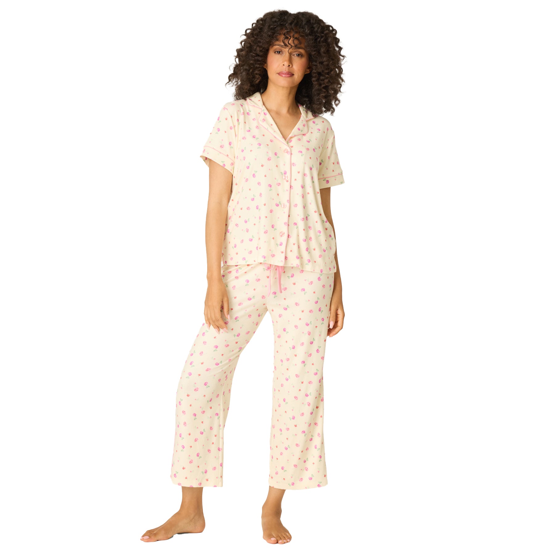 Women’s soft cream pyjama set with delicate pink floral print, short sleeve top, and comfortable lounge pants – front view