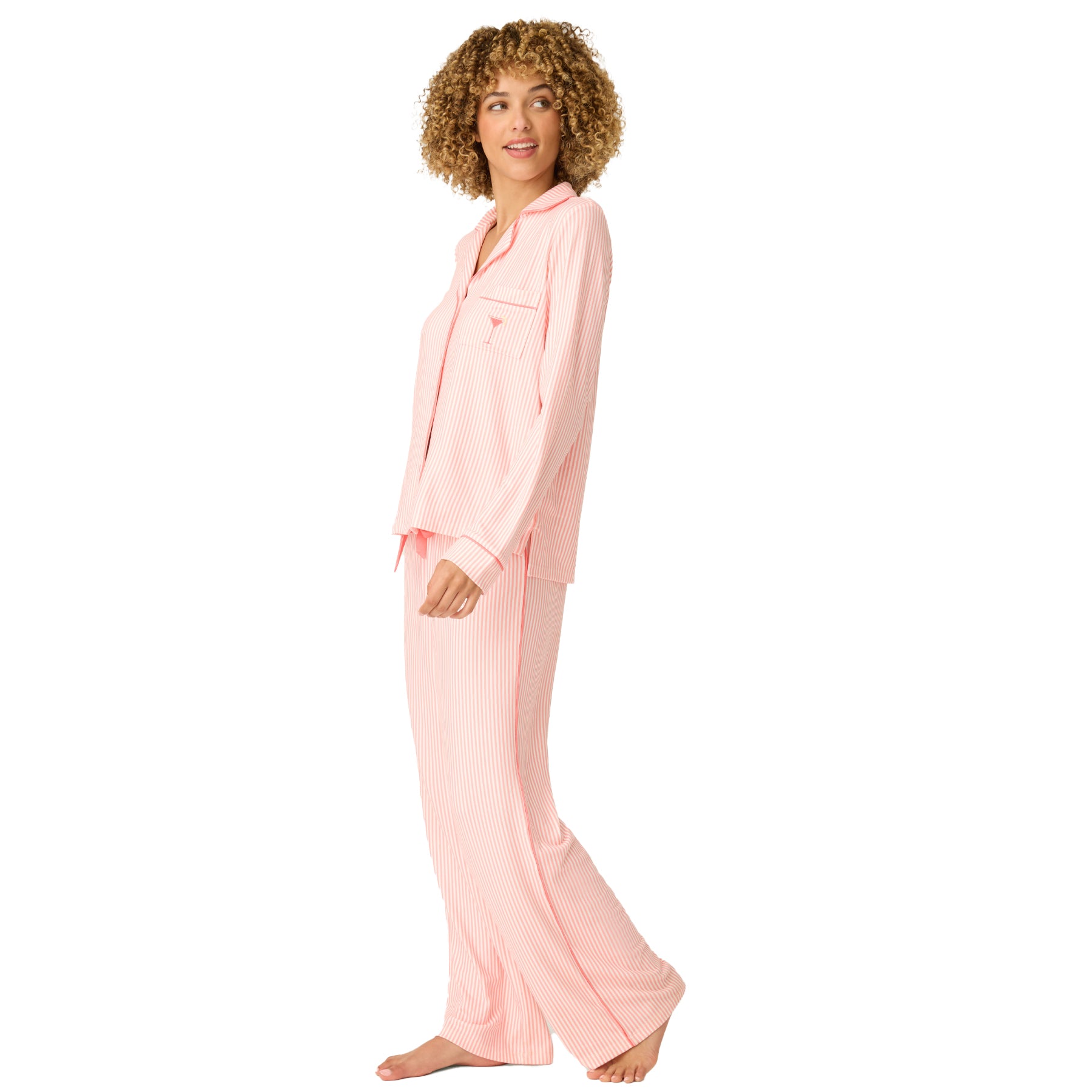 Side view of women’s pink striped pyjama set with relaxed fit top and straight-leg pants