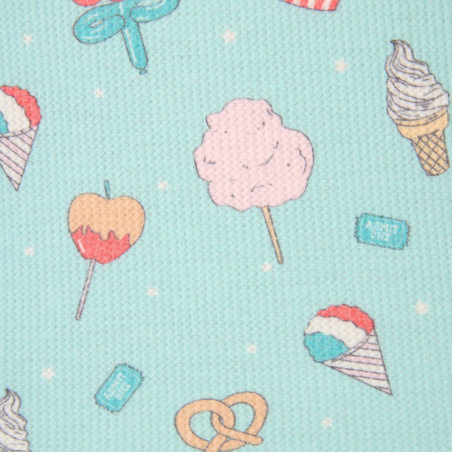 Close-up of textured blue pajama fabric with playful snack print featuring ice cream, popcorn, pretzels, and cotton candy