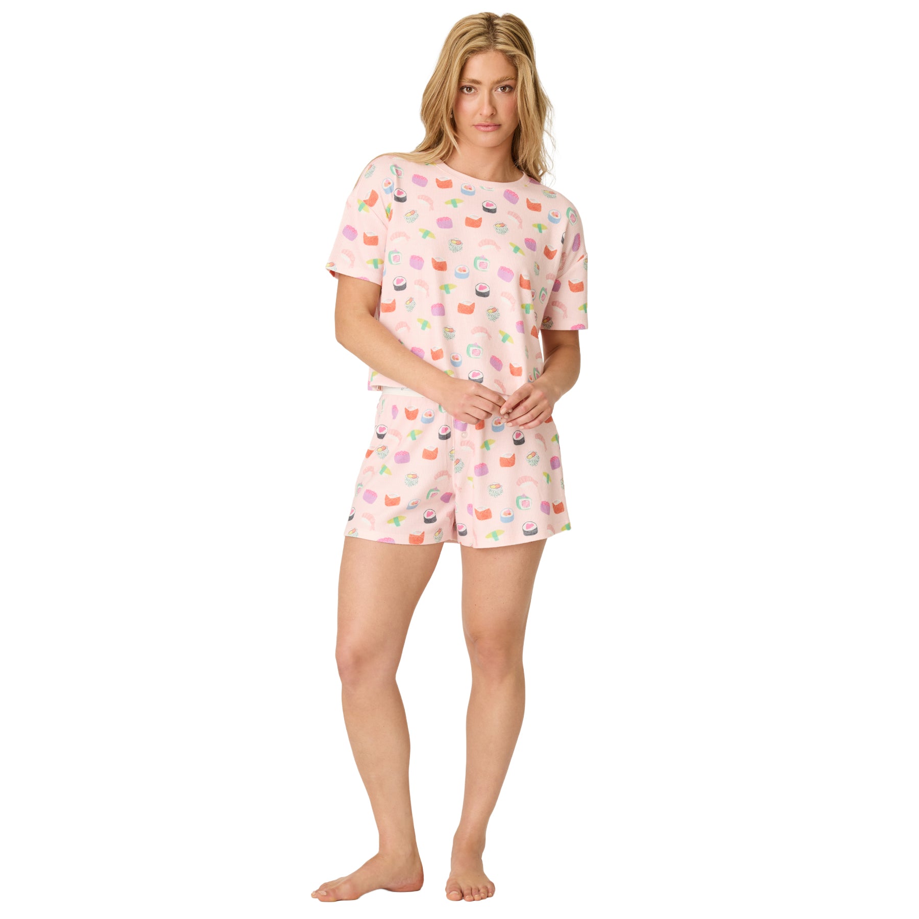 Women's light pink waffle knit pajama set with whimsical sushi print, including a relaxed short sleeve top and matching lounge shorts.