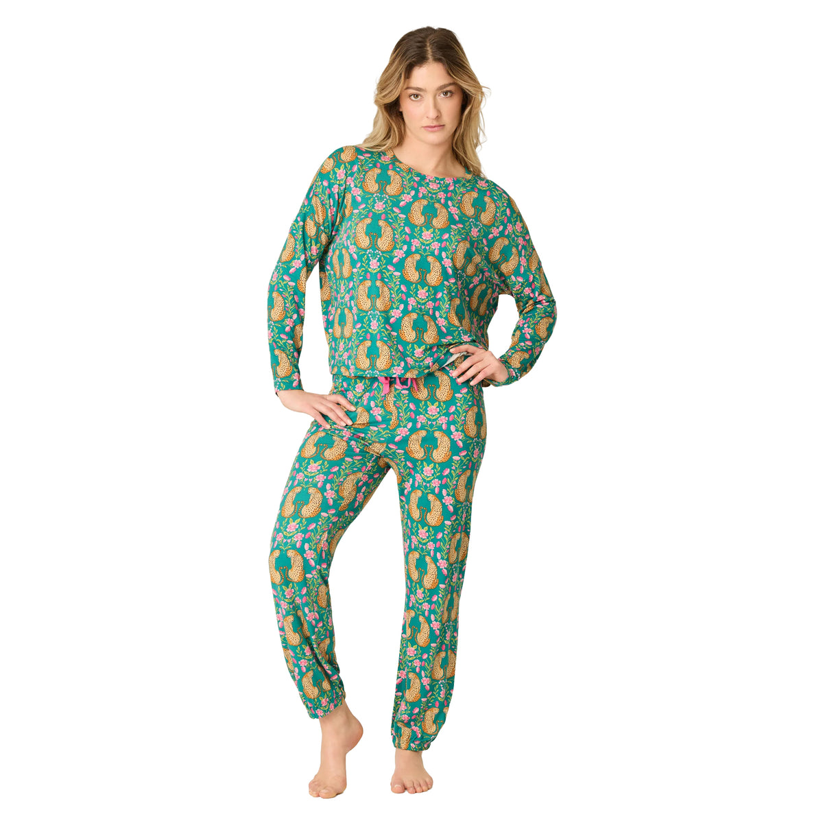 Model wearing a teal long-sleeve pajama set with cheetah and pink floral print, finished with pink drawstring detail.