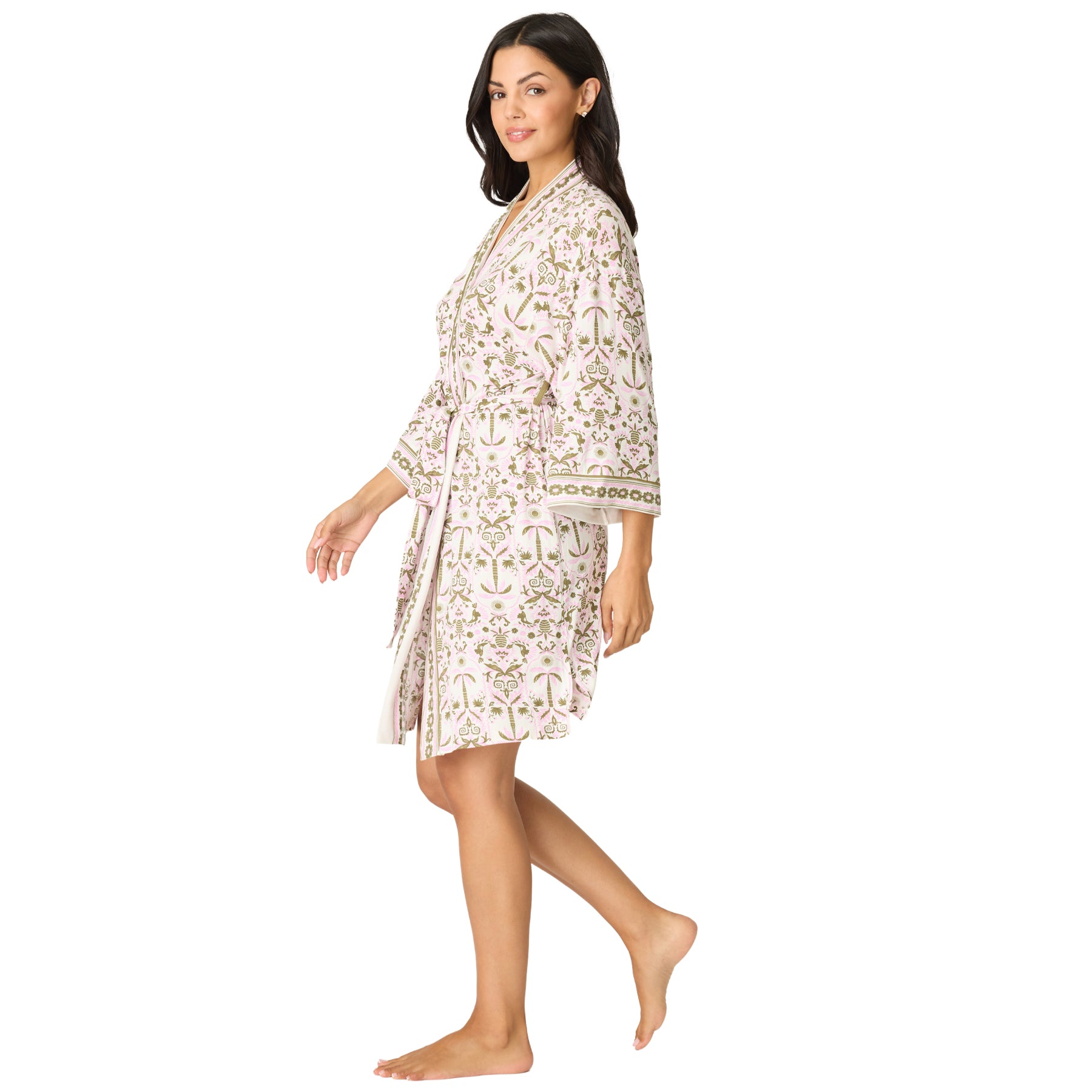 Side view of a women's pink botanical print kimono robe with a relaxed fit, wide three-quarter sleeves, and self-tie belt.