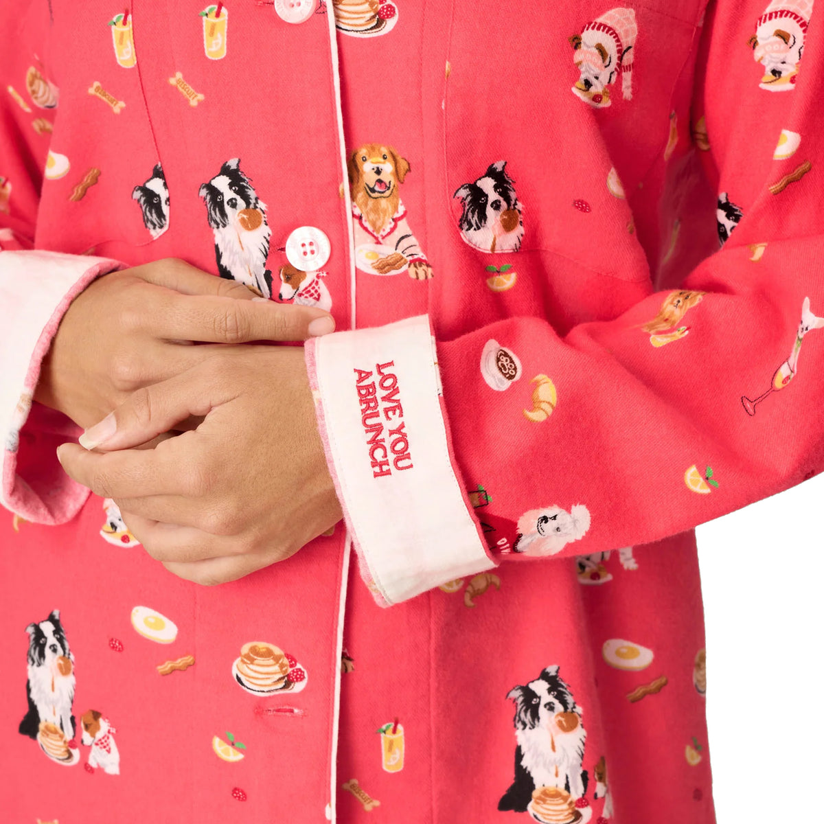 Close-up of PJ Salvage Brunch Pups flannel pyjama top featuring playful dog and breakfast print with embroidered Love You A Brunch cuff.