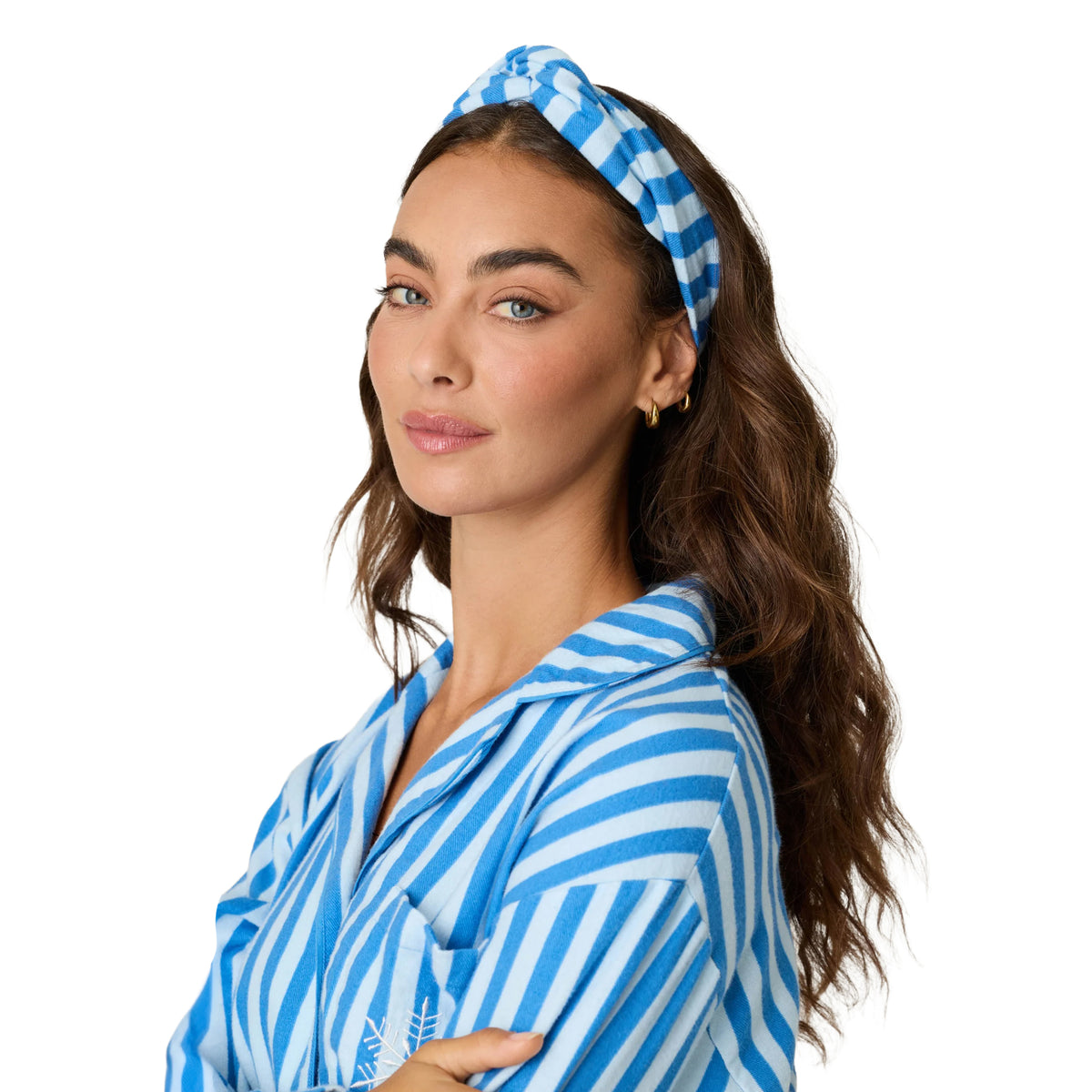 Close-up of model wearing blue and white striped flannel pajama top with matching knotted headband.