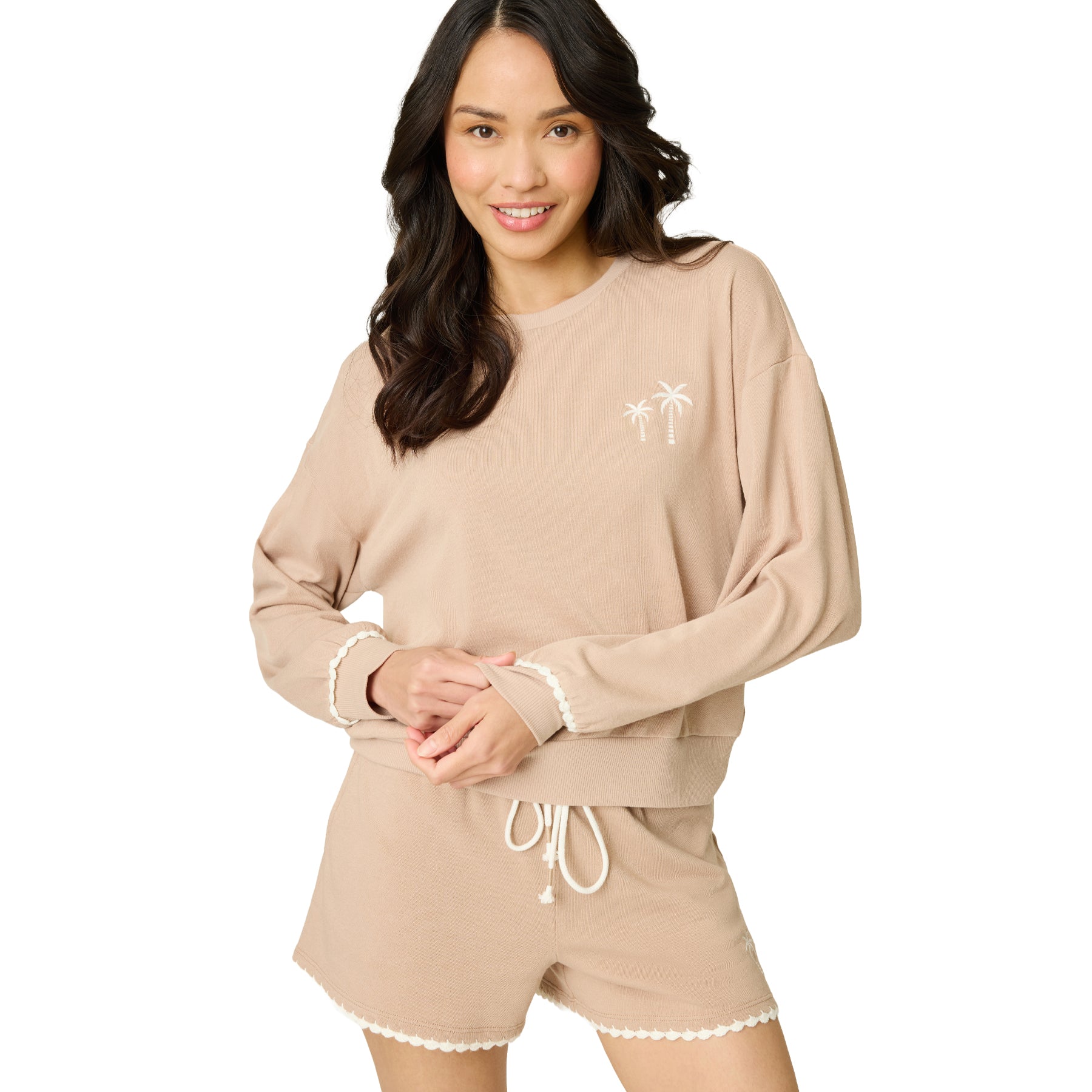 Women's warm taupe lounge set featuring a relaxed long sleeve sweatshirt with embroidered palm trees and matching drawstring shorts with scalloped trim.