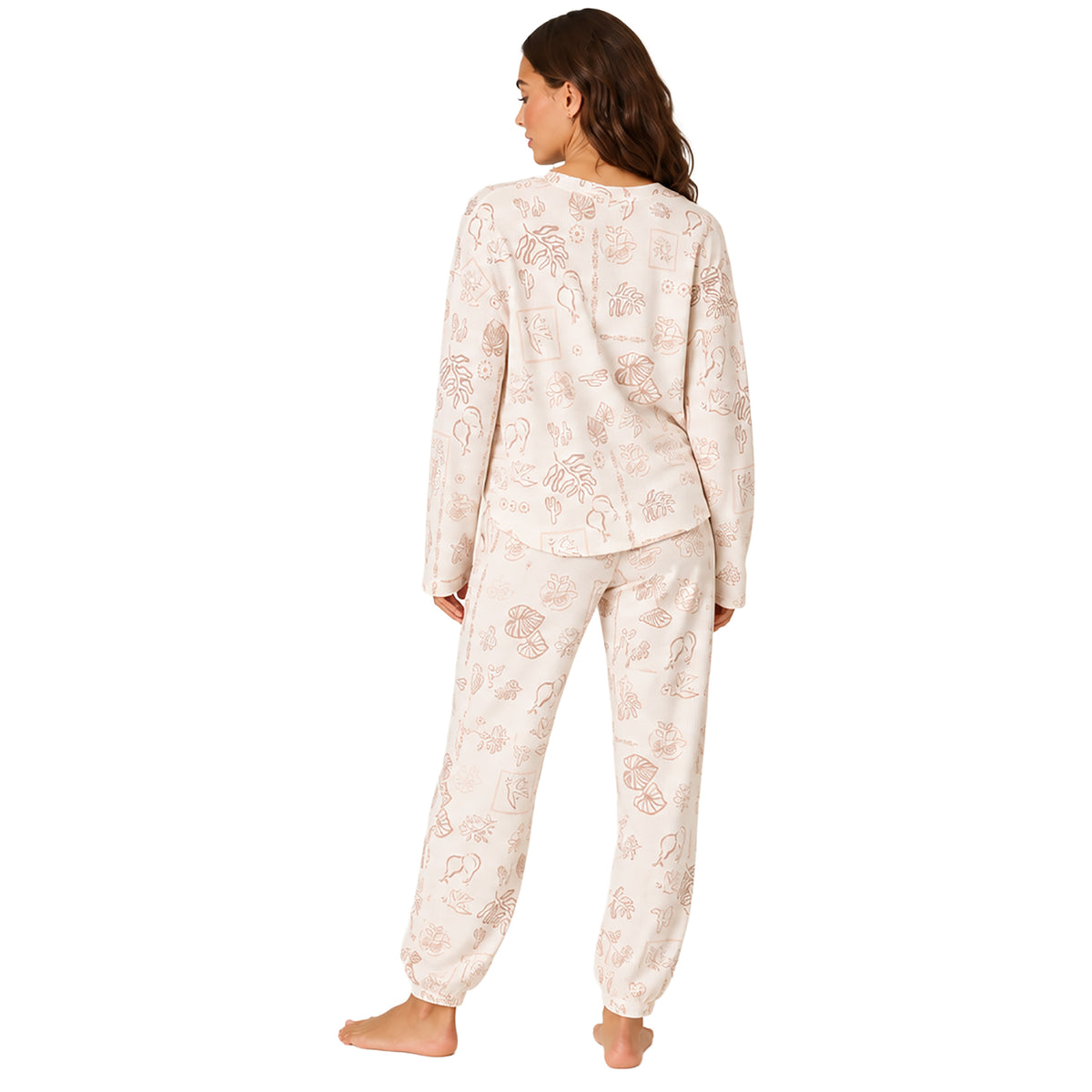Back view of a women's ivory waffle knit lounge top with a tropical print paired with warm taupe lounge shorts with scalloped hem.