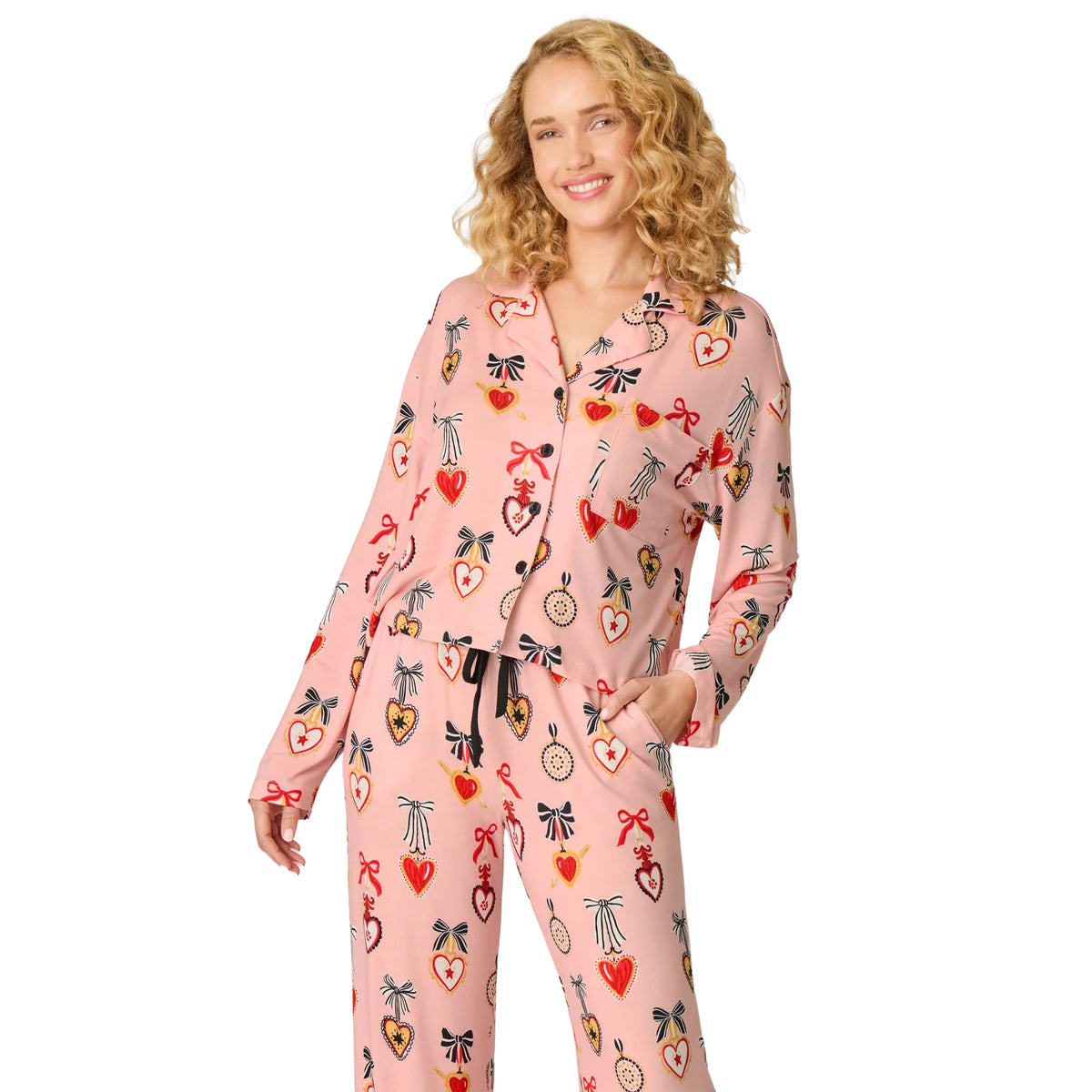 PJ Salvage modal pyjama set featuring a pink button-front top with chest pocket and matching drawstring pants, front view.