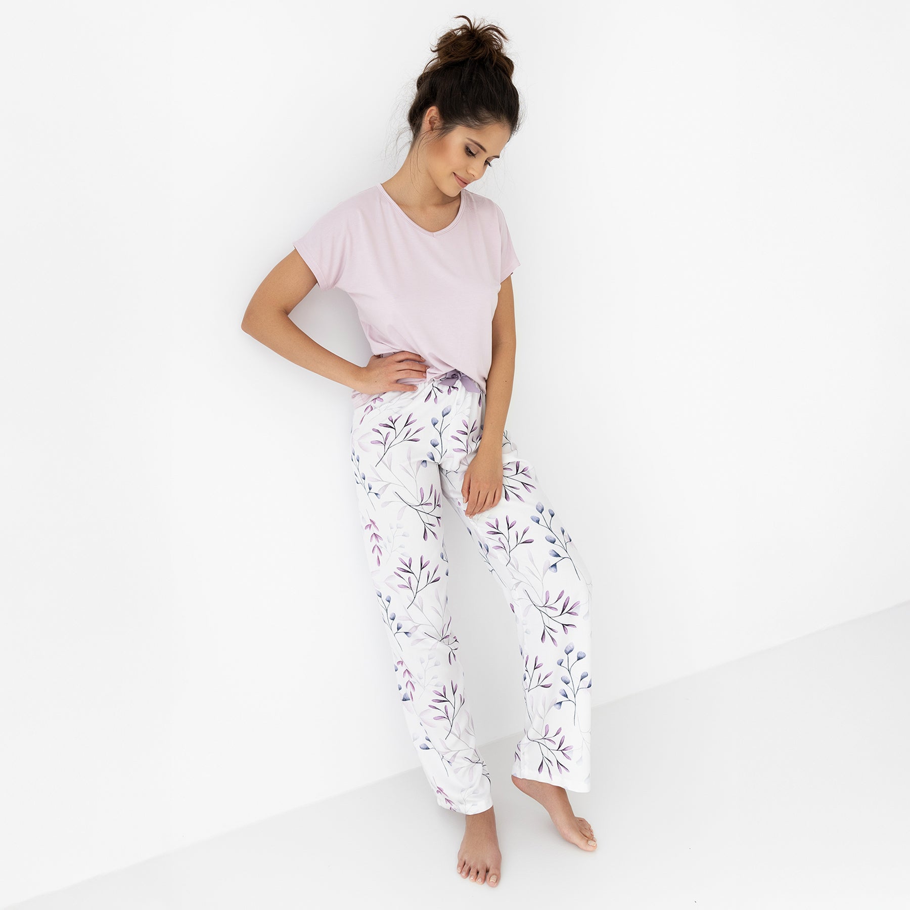 Lavender short-sleeve tee and white pajama pants with soft purple leaf print, styled for comfortable homewear