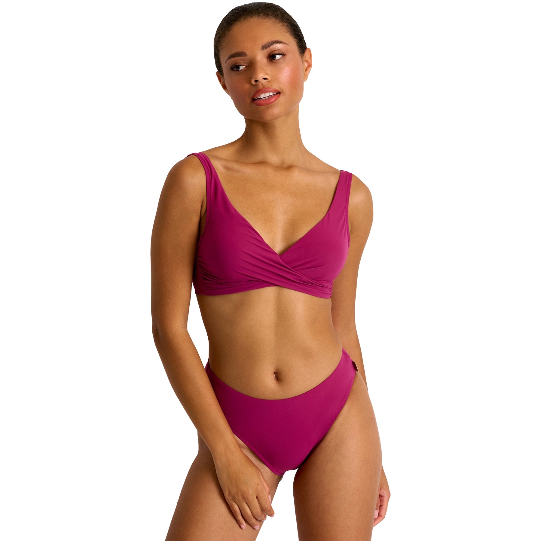 Woman wearing SHAN Classic bikini top and Classic high-cut bikini bottom in magenta, featuring a flattering twist-front design and sleek minimalist fit.