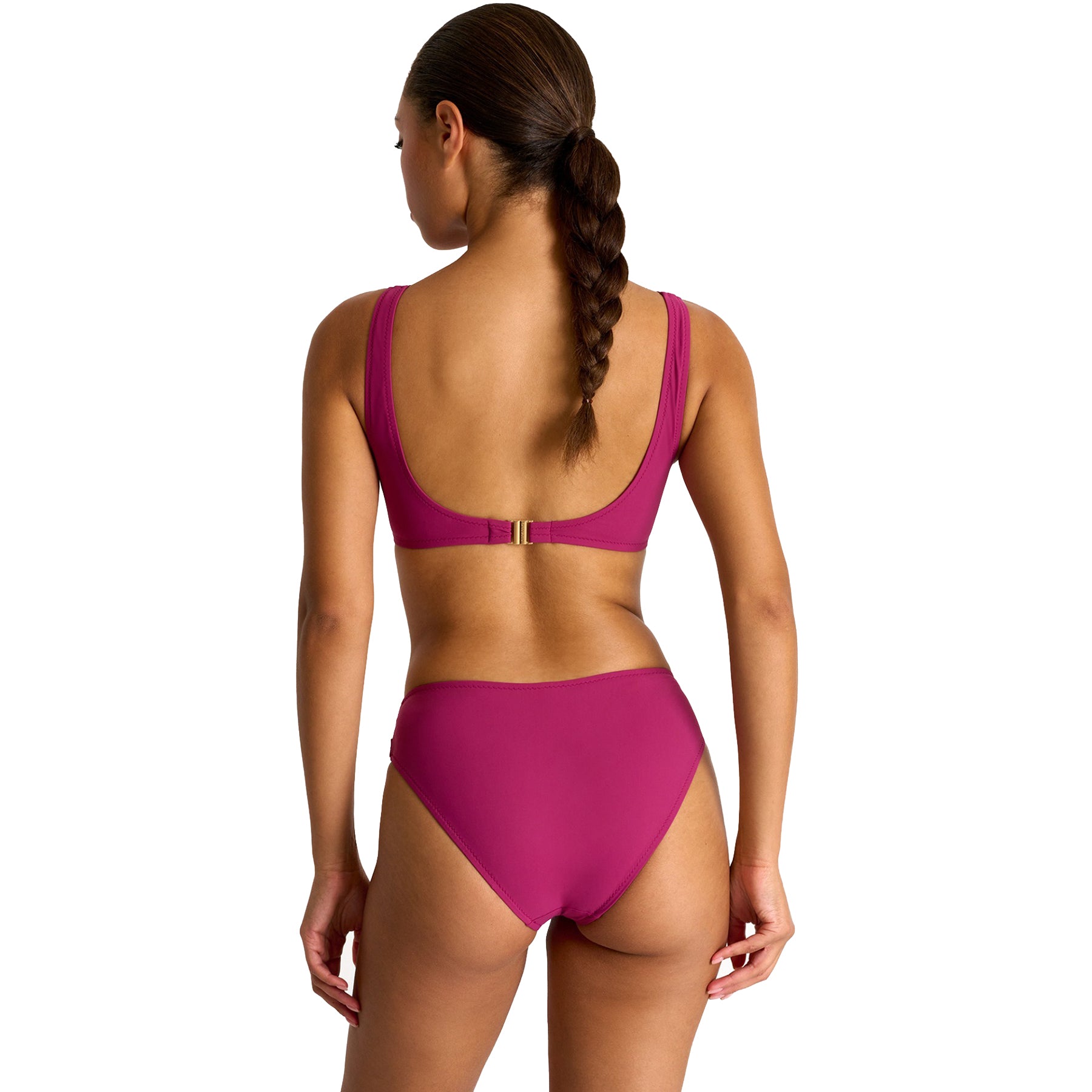 Back view of woman wearing SHAN Classic bikini top and Classic high-cut bikini bottom in magenta, featuring a flattering twist-front design and sleek minimalist fit.