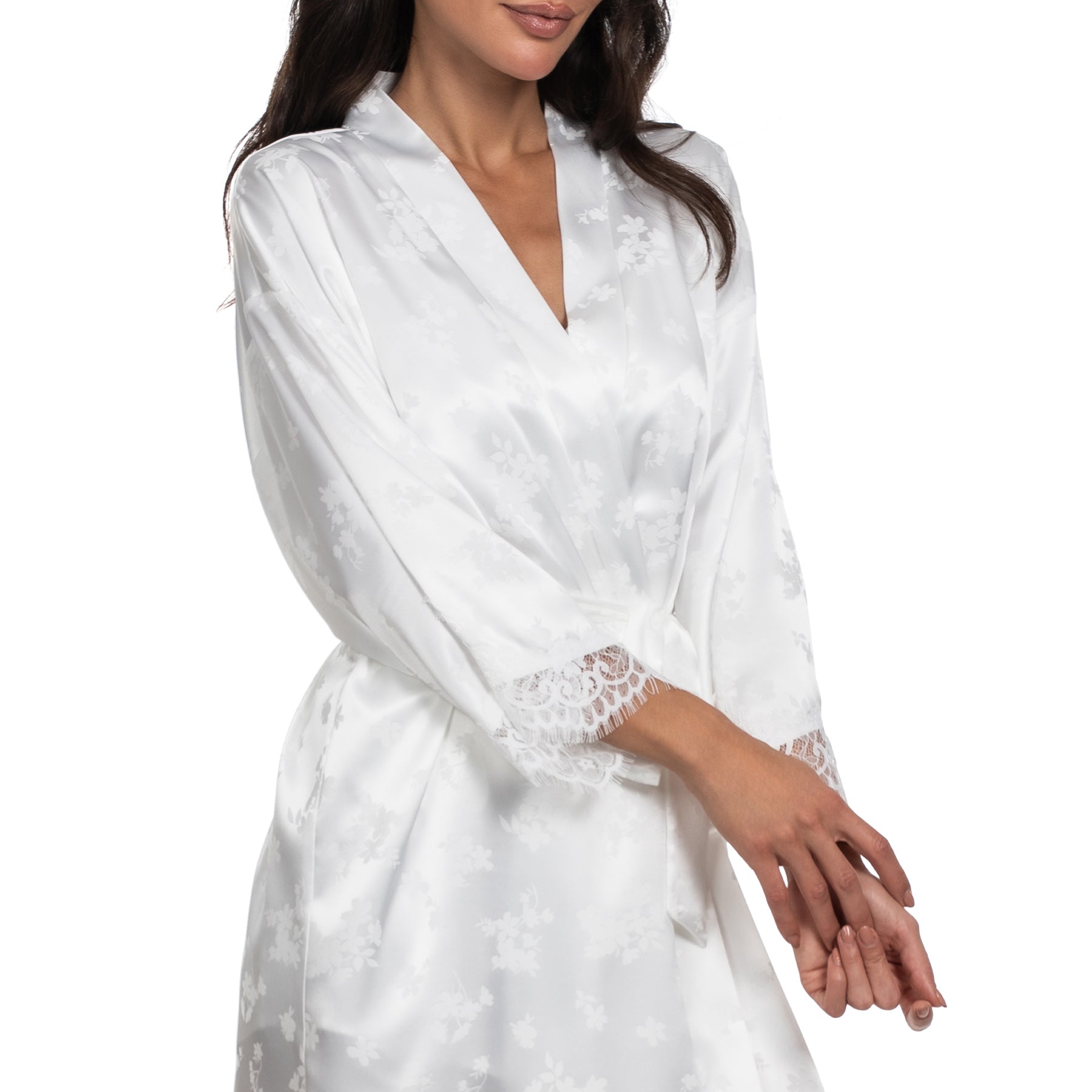 Ivory satin robe with subtle floral jacquard pattern, lace-trim cuffs and tie waist, close-up view.