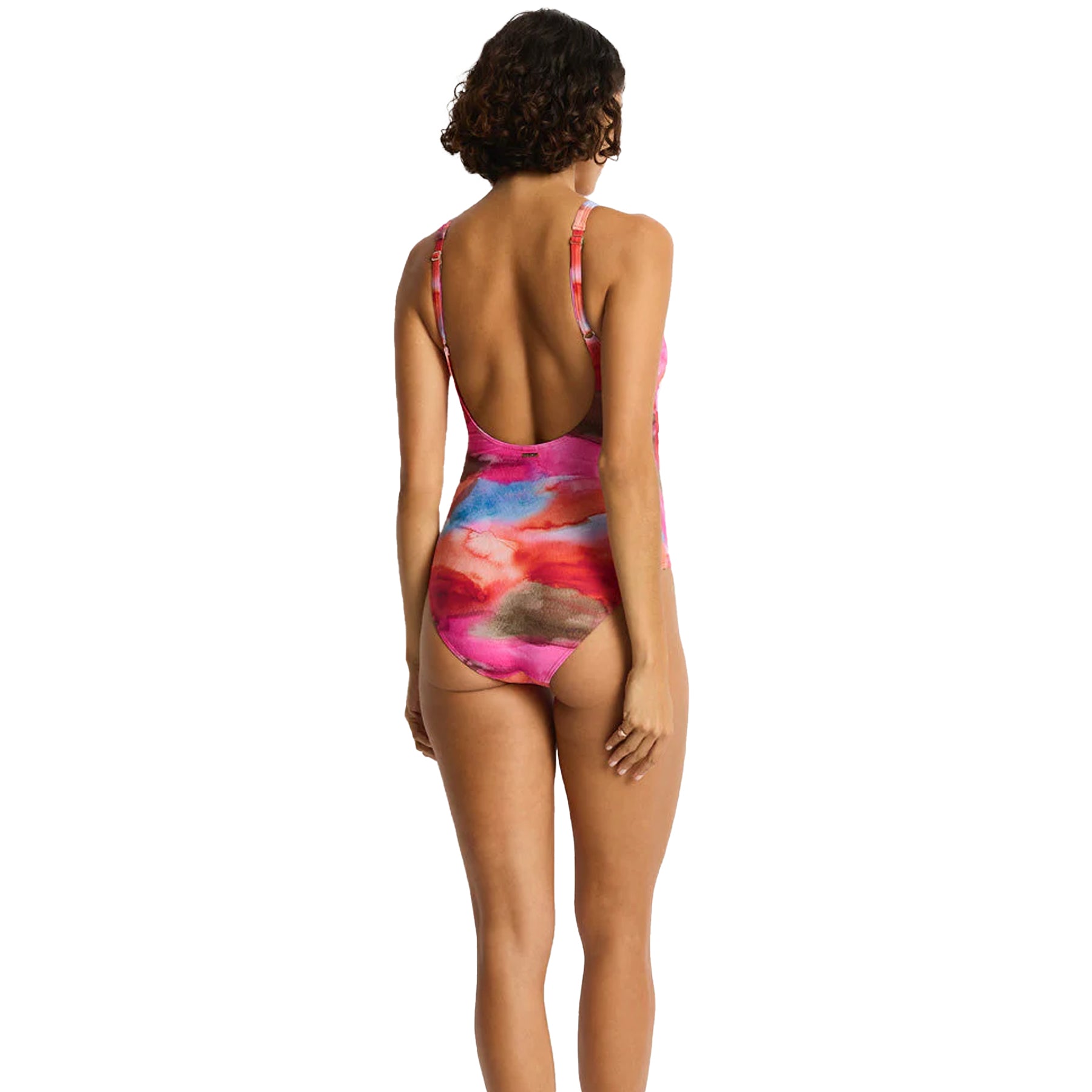 Back view of pink printed one-piece swimsuit with scoop back and adjustable straps on model