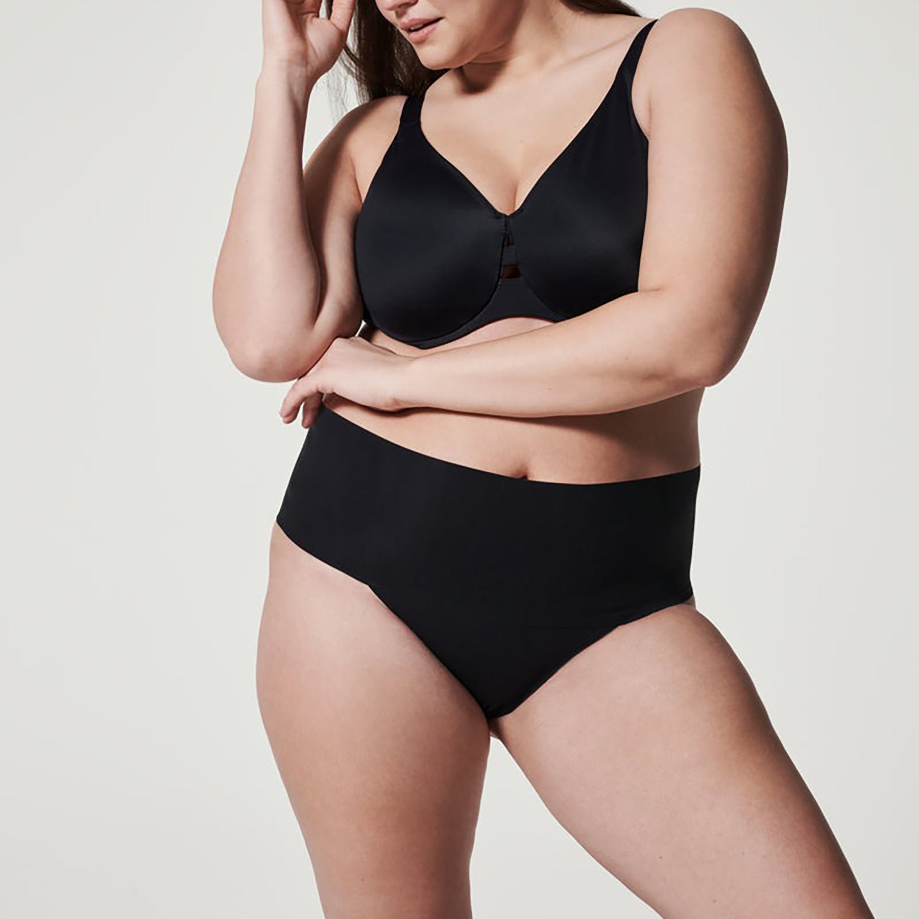 Front view of SPANX High-Waist Control Seamless Thong in Very Black, providing smooth shaping and seamless coverage.